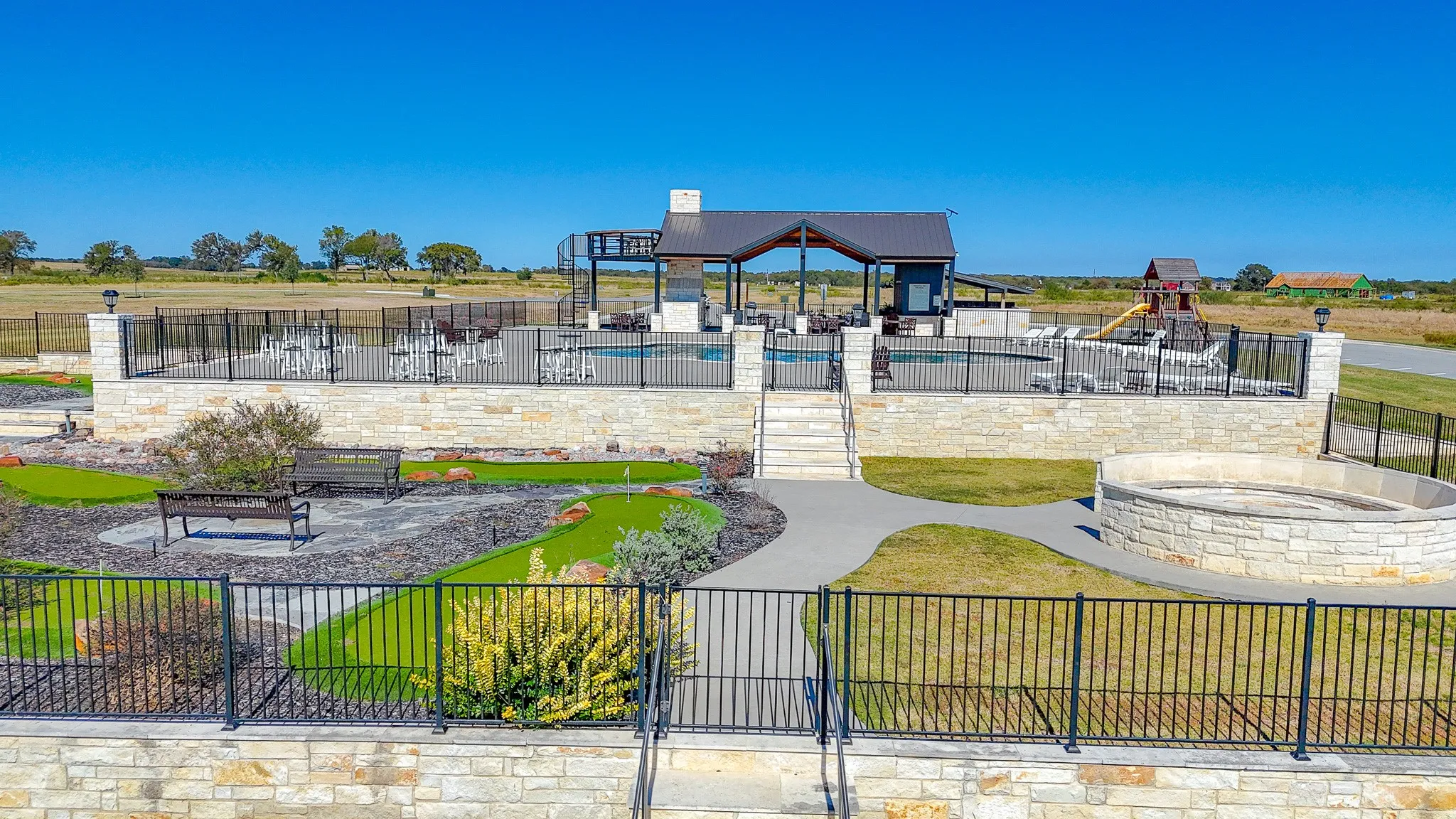 View of home's community featuring a patio, a swimming pool, and a jacuzzi