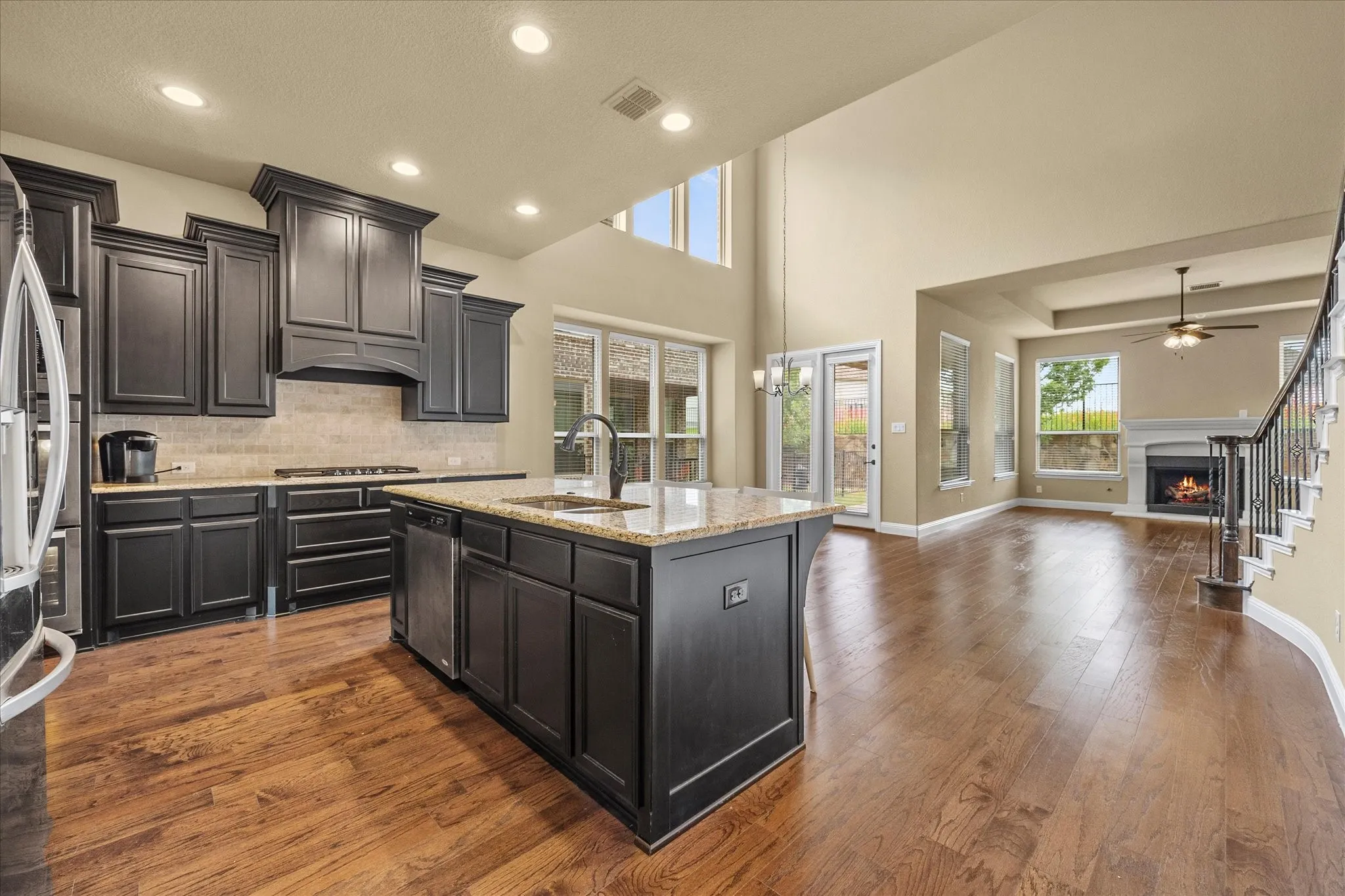 Open floor plan features dream kitchen opening onto breakfast area and family room.