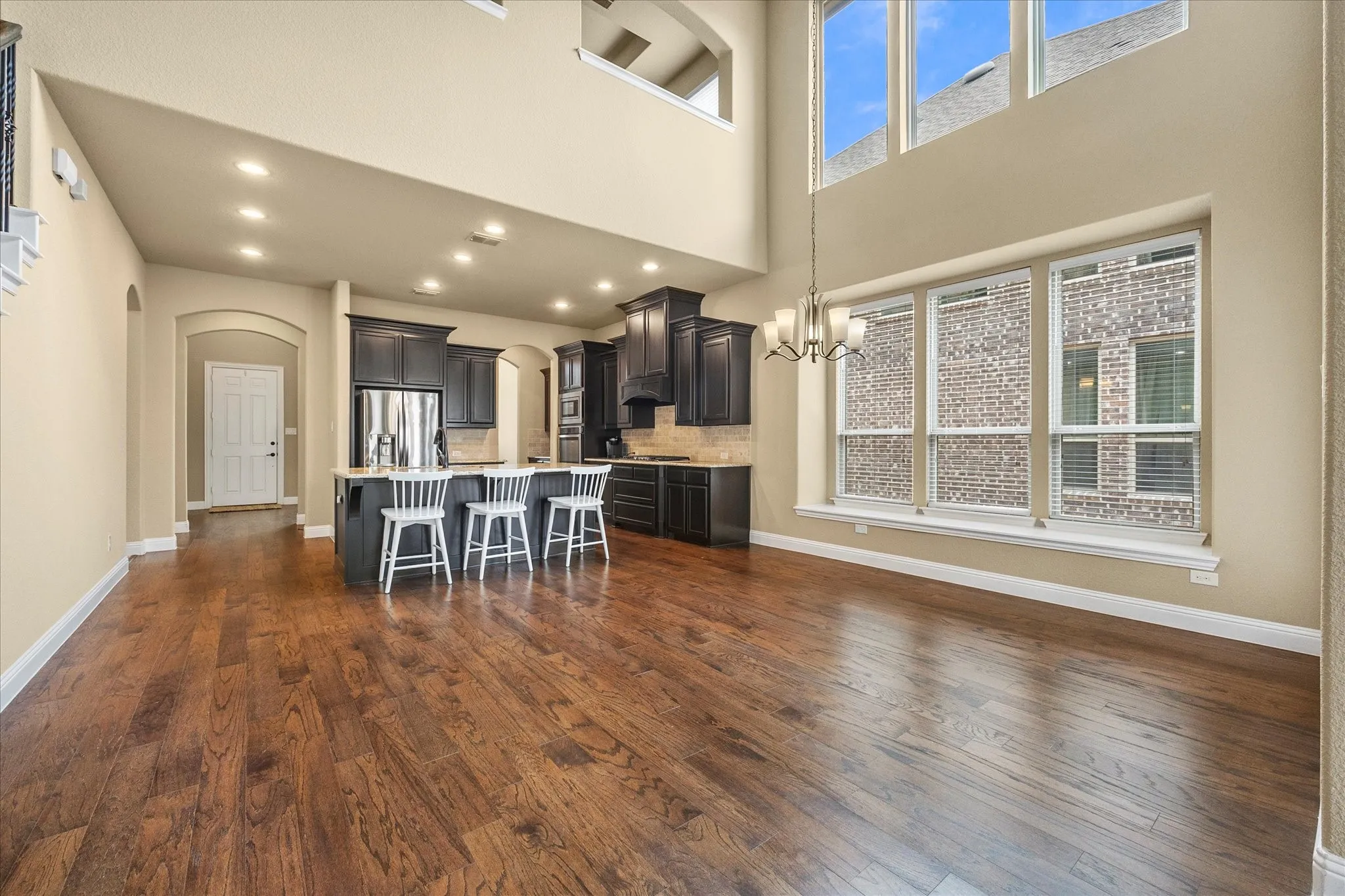 Spacious breakfast area over looks kitchen and includes banks of windows providing ample natural lighting!