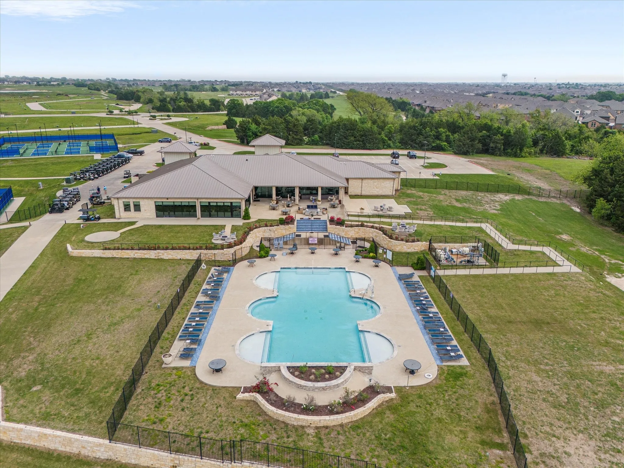 Resort style community includes pool, clubhouse, tennis/racquet ball courts overlooking 18 hole golf course and beautiful Lake Ray Hubbard!
