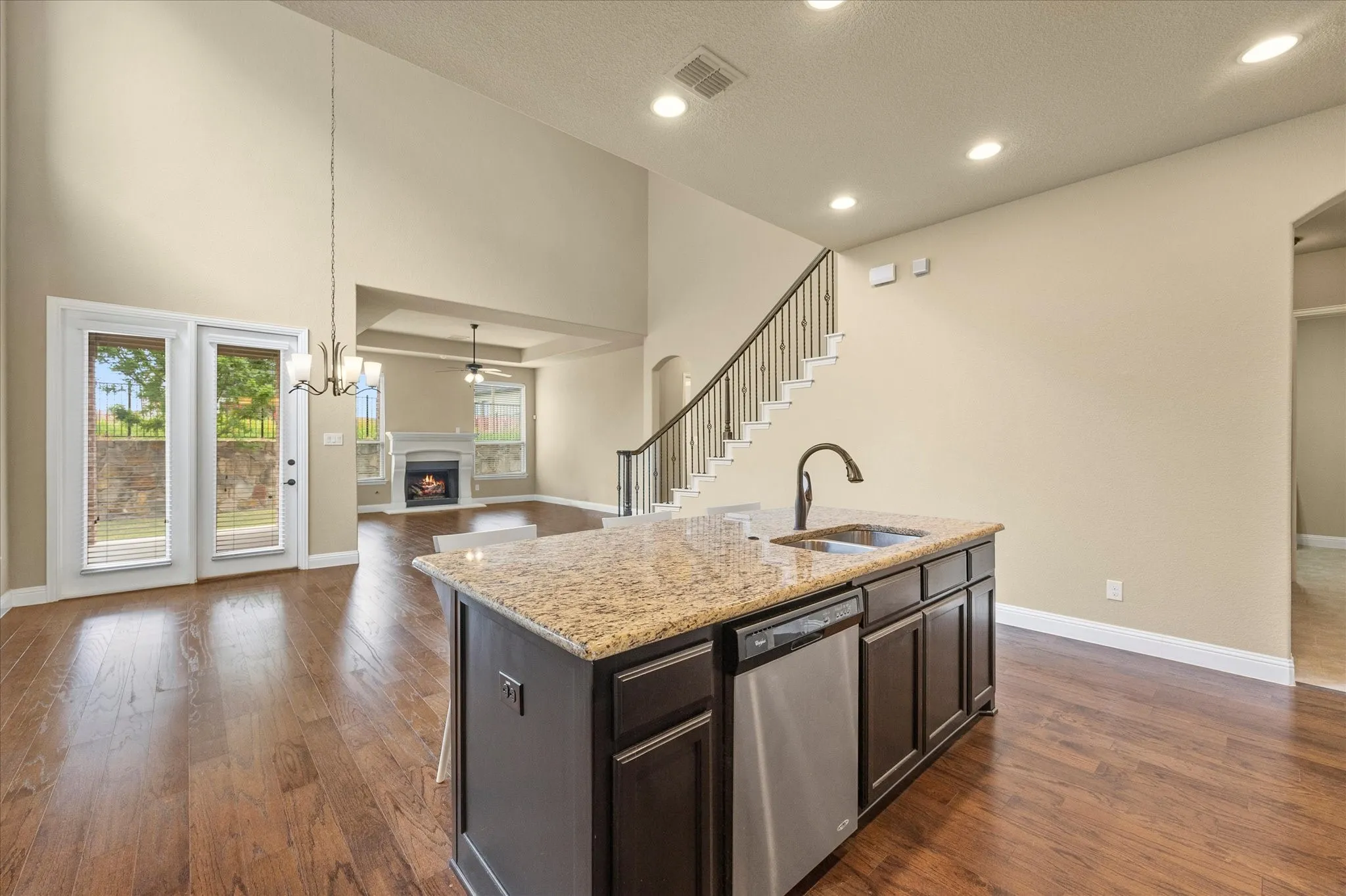 Kitchen overlooks breakfast and living area and features towering ceilings!