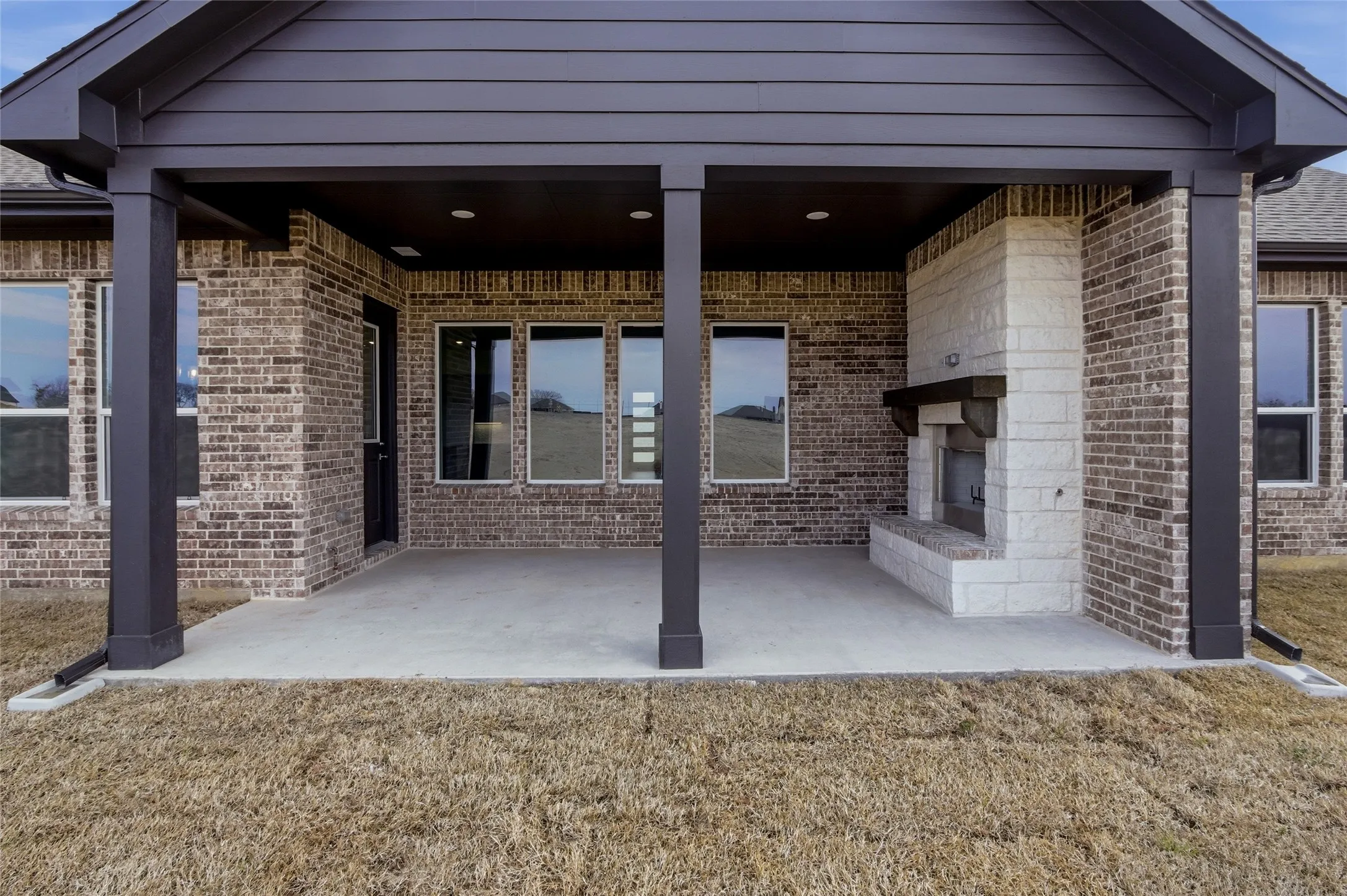 View of patio / terrace featuring a fireplace