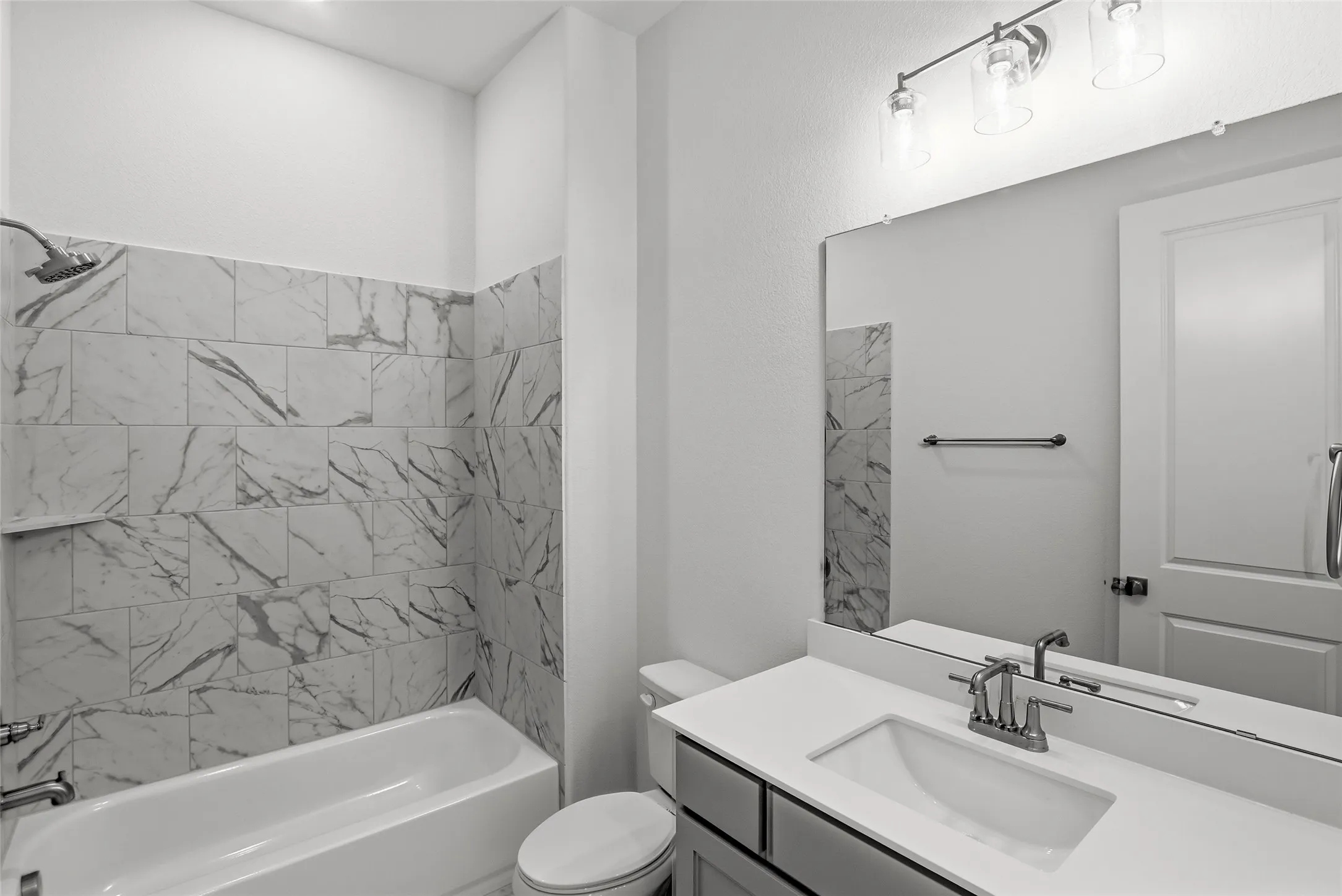 Full bathroom featuring vanity and bathing tub / shower combination