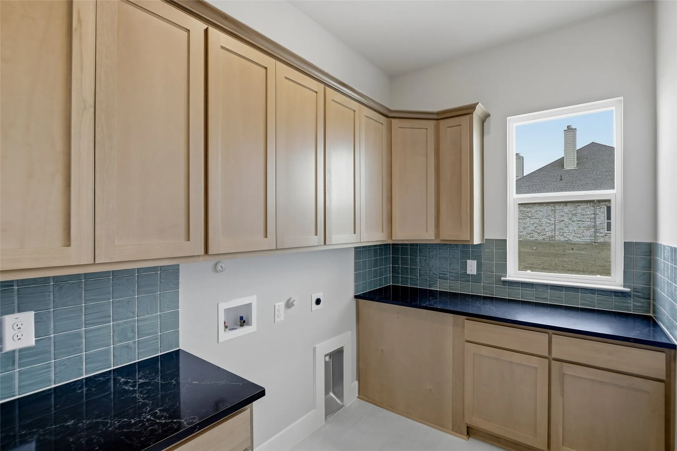 Laundry room featuring hookup for a washing machine, hookup for an electric dryer, hookup for a gas dryer, and cabinet space