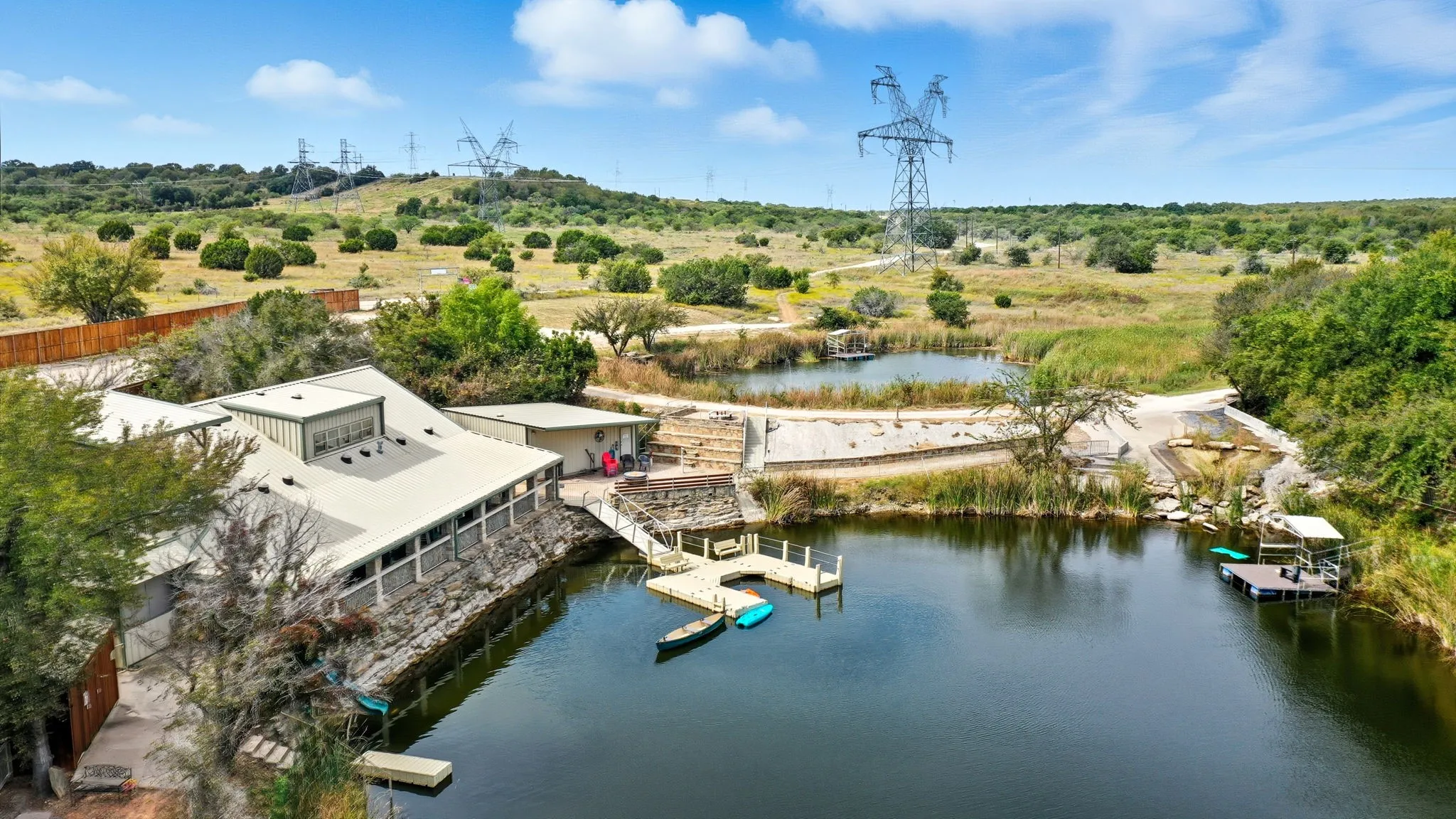 Aerial view of a tree filled landscape and a nearby body of water