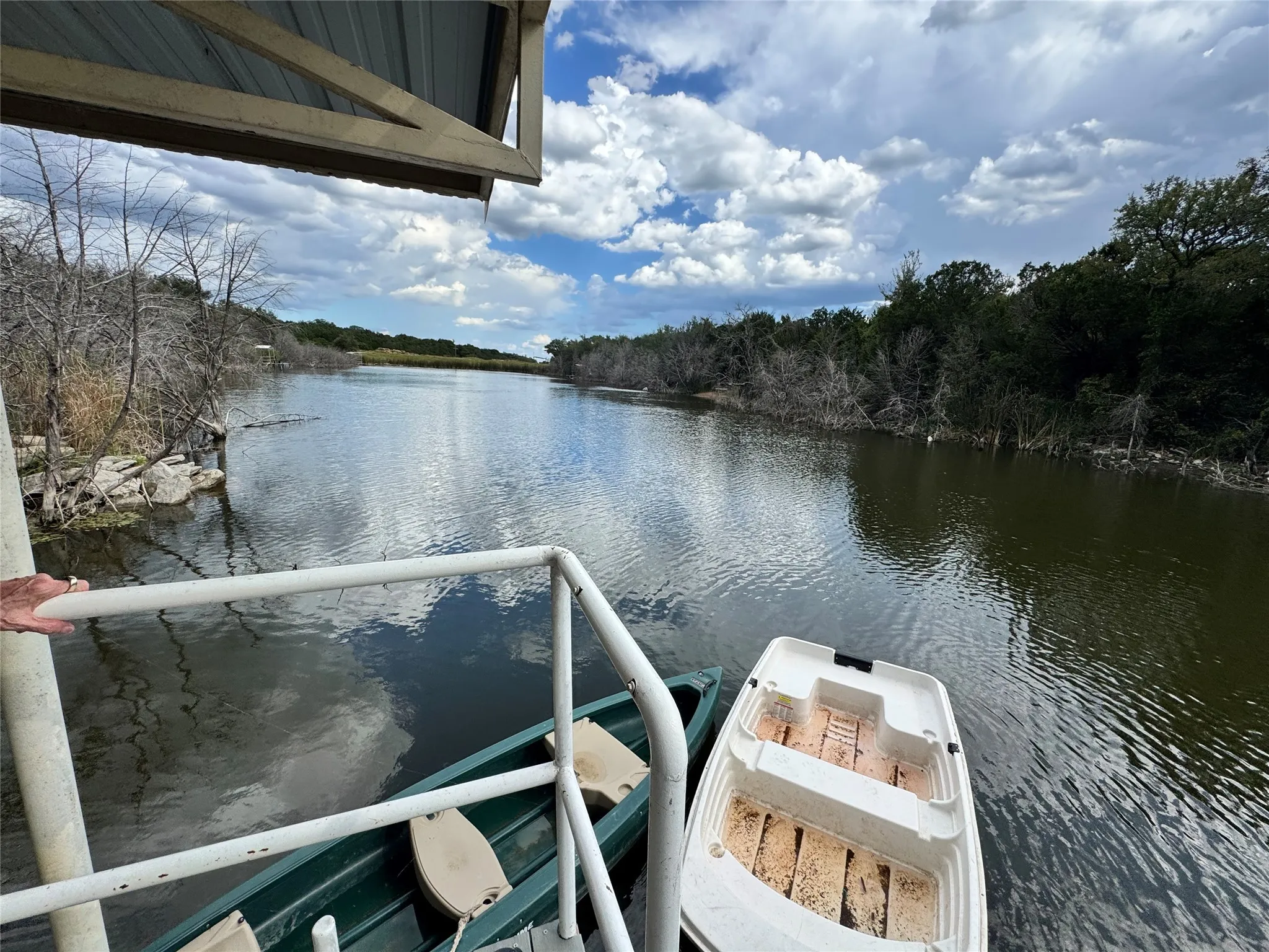 Dock area featuring a water view and a balcony