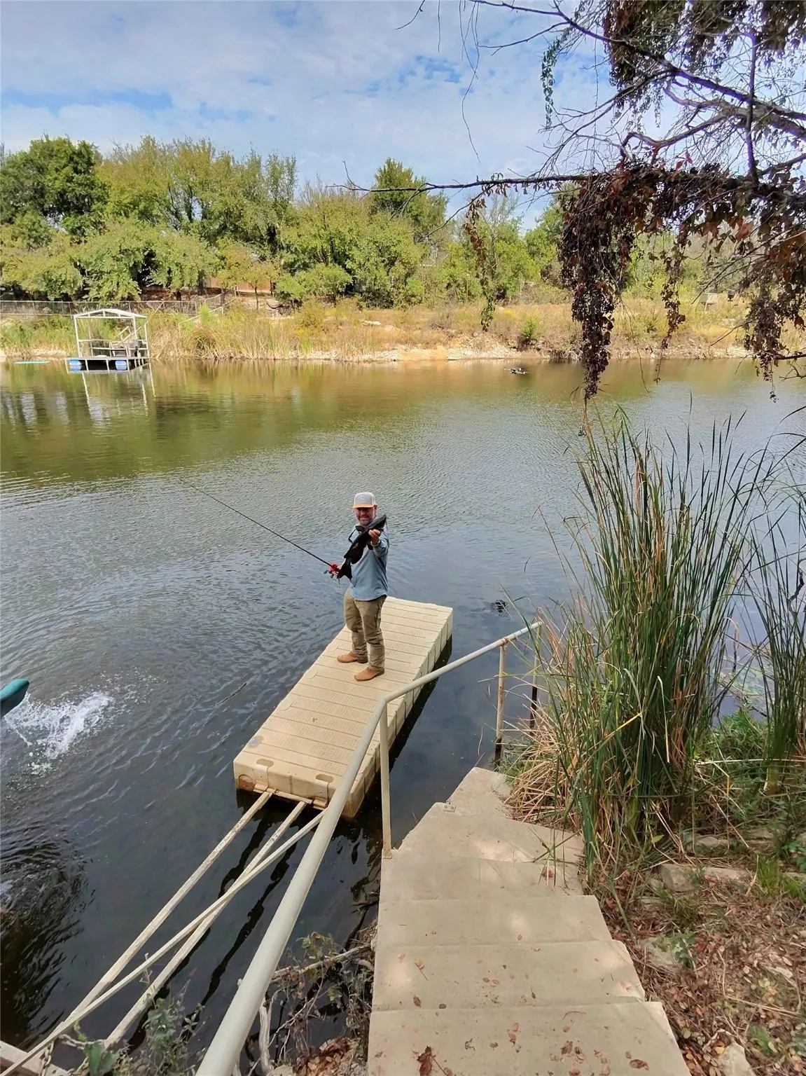 Dock area featuring a water view