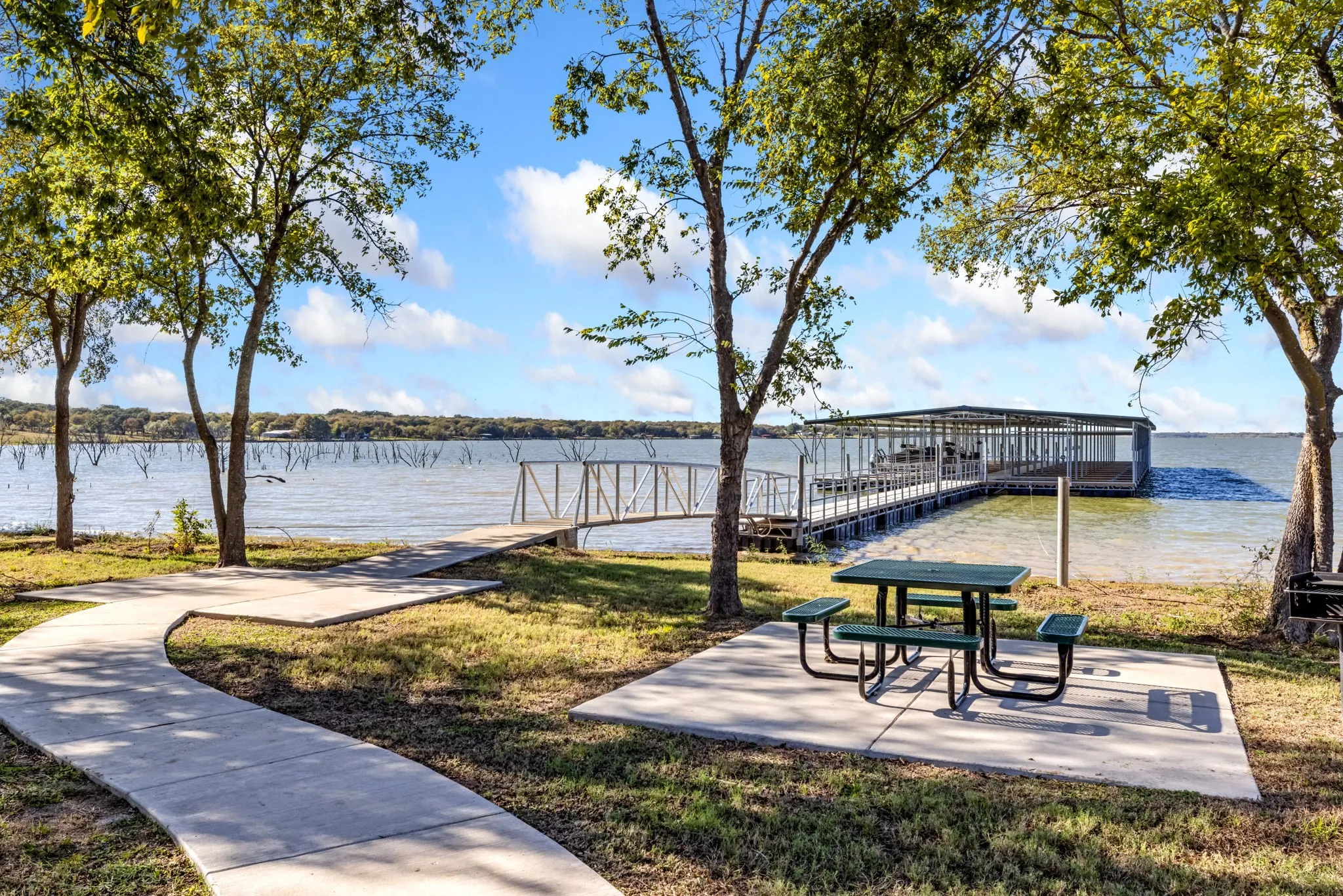 Dock area with a water view  and picnic facility