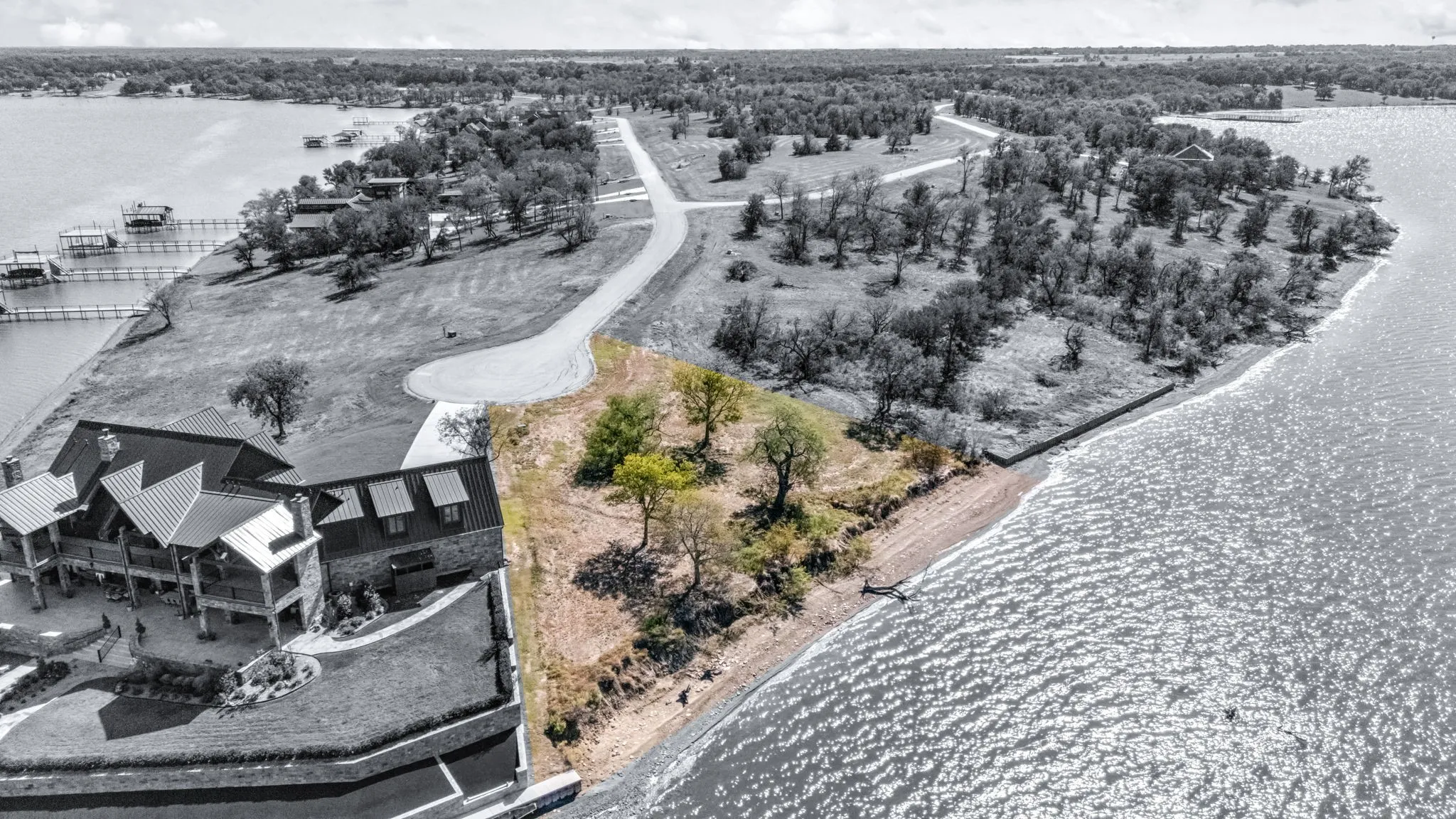 Aerial view of sparsely populated area featuring a large body of water