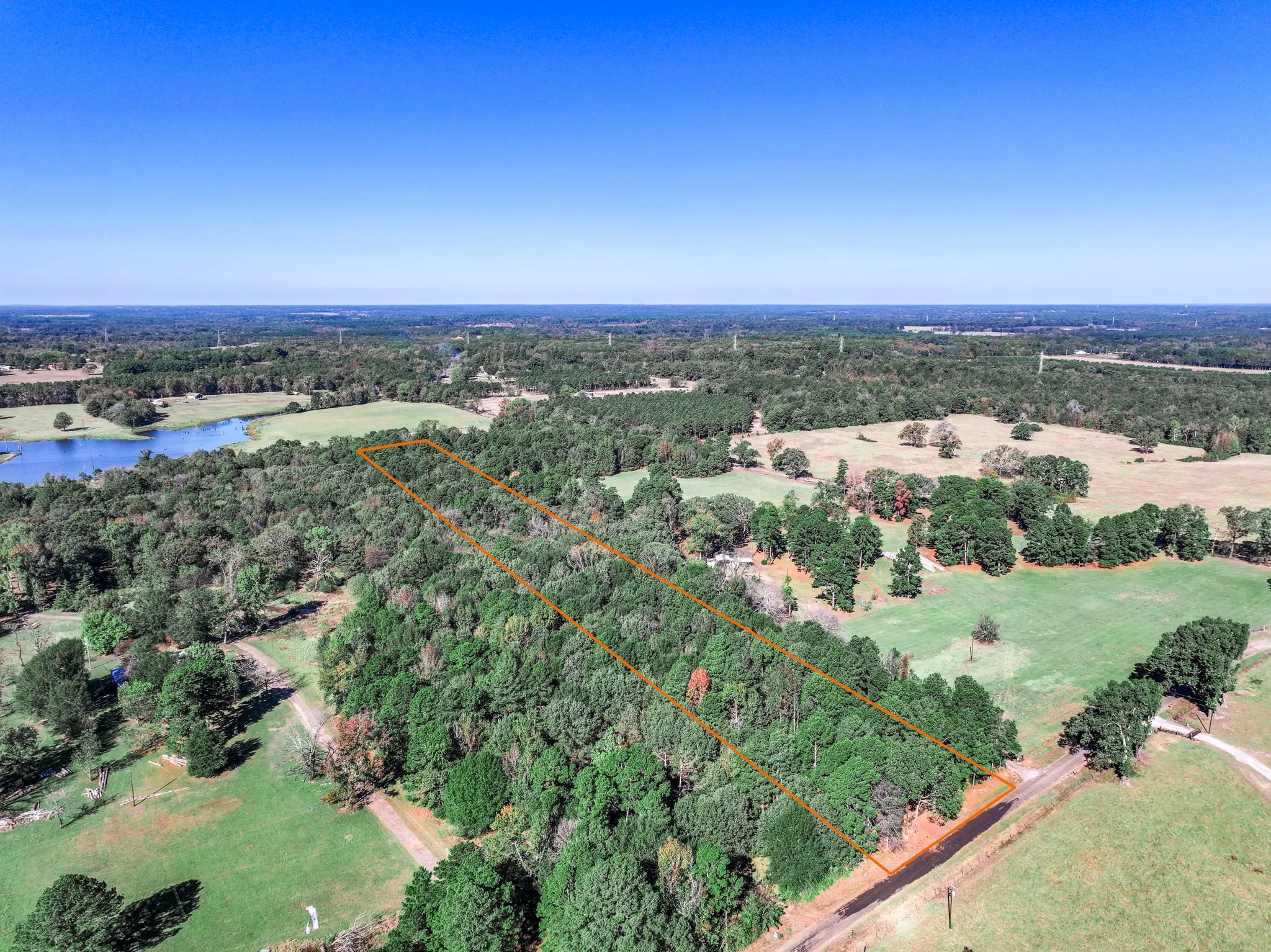 Aerial overview of property's location with property parcel outlined