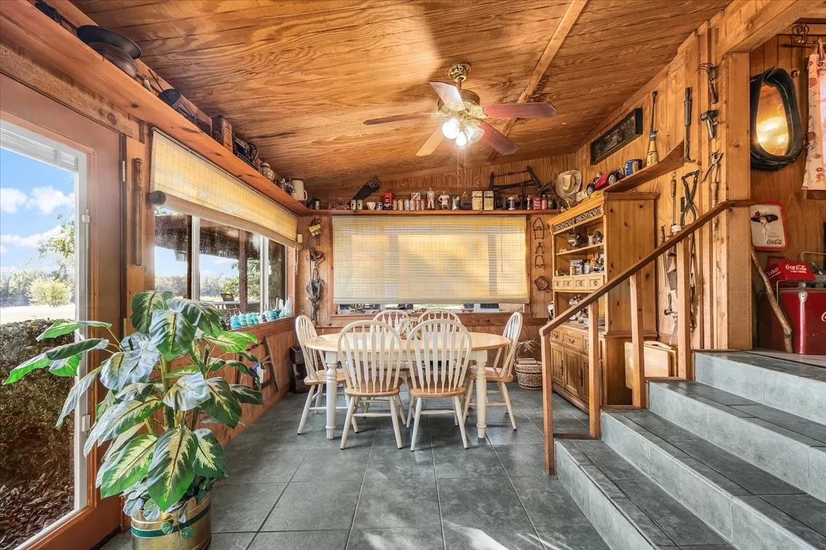 Sunroom featuring vaulted ceiling
