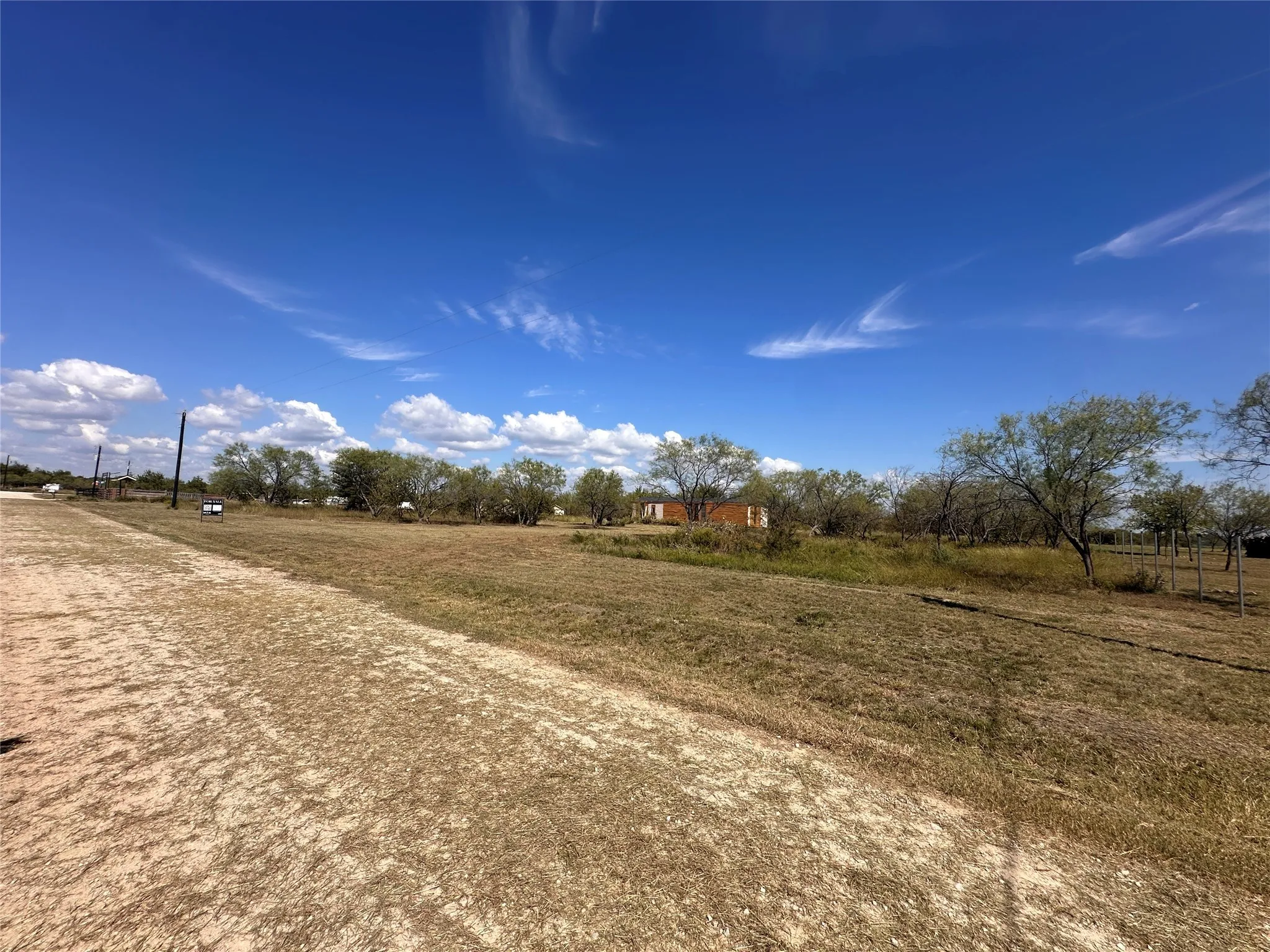 View of yard with a rural view