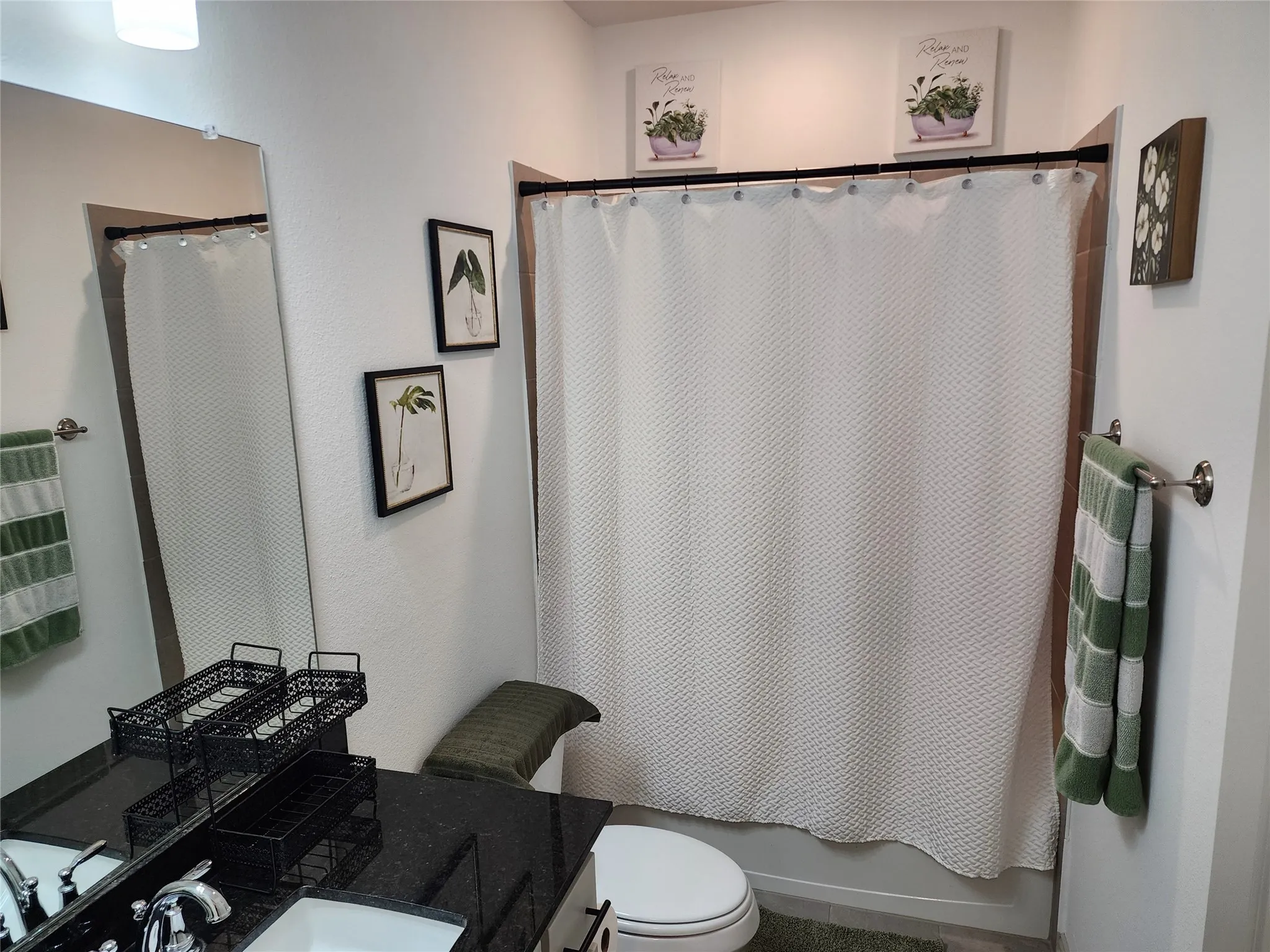 Full bath with vanity and shower / bath combination with curtain