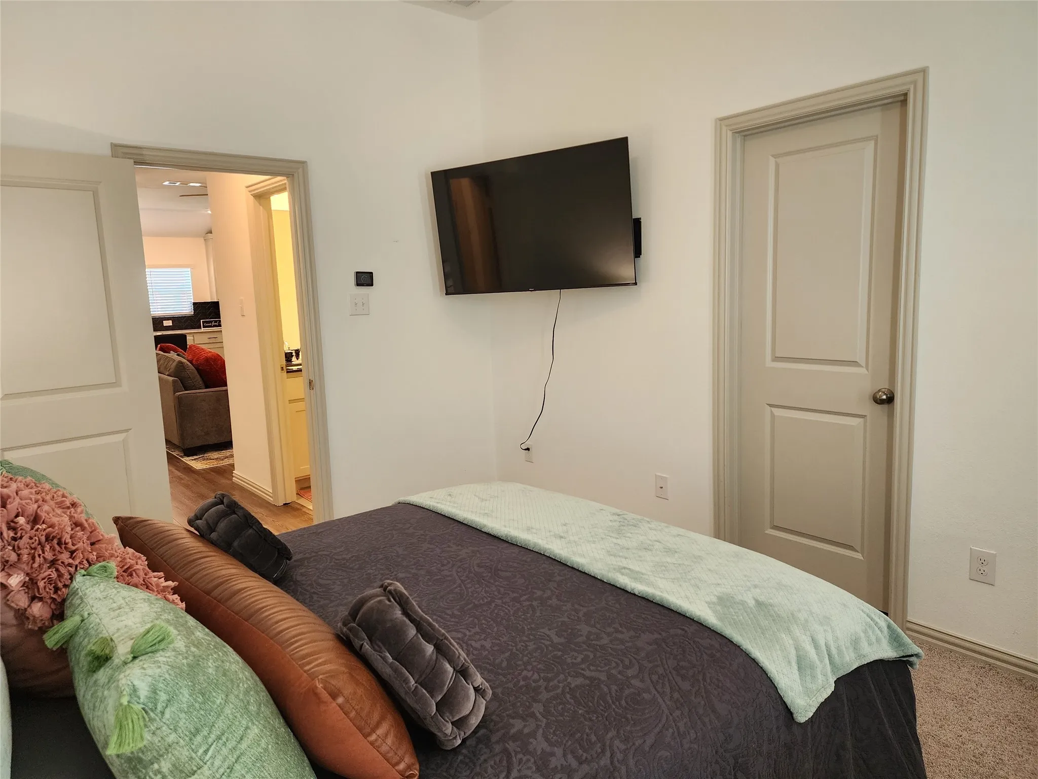 Bedroom with baseboards and carpet