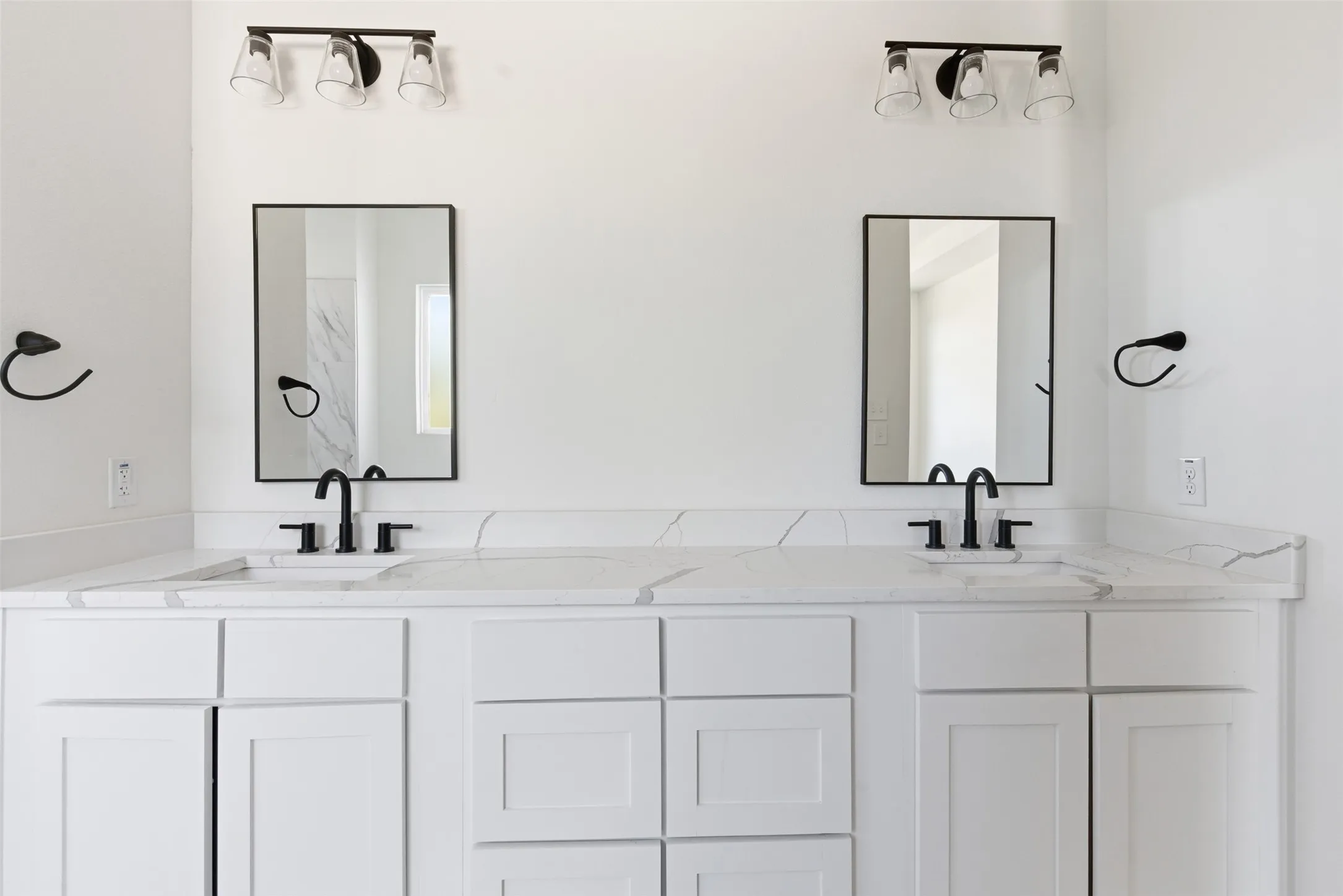 Bathroom featuring double vanity