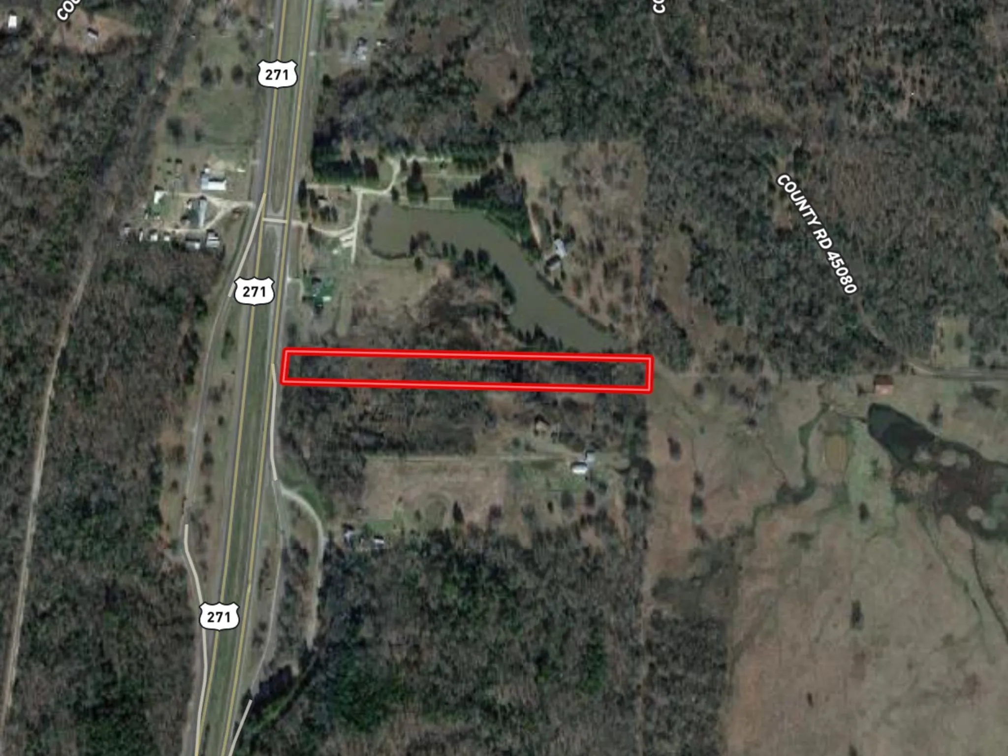 Aerial overview of property's location featuring property parcel outlined