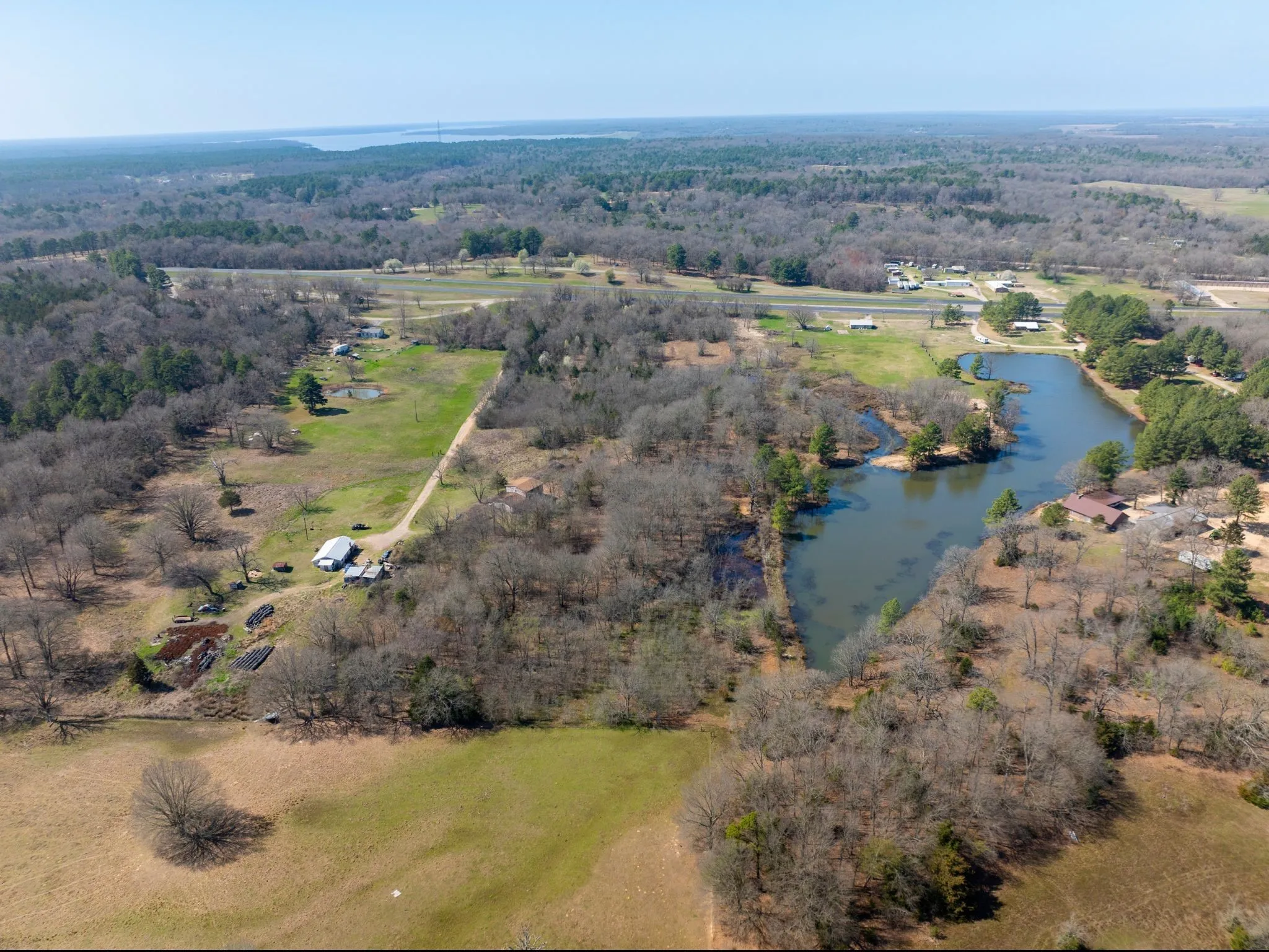 Aerial overview of property's location with a large body of water