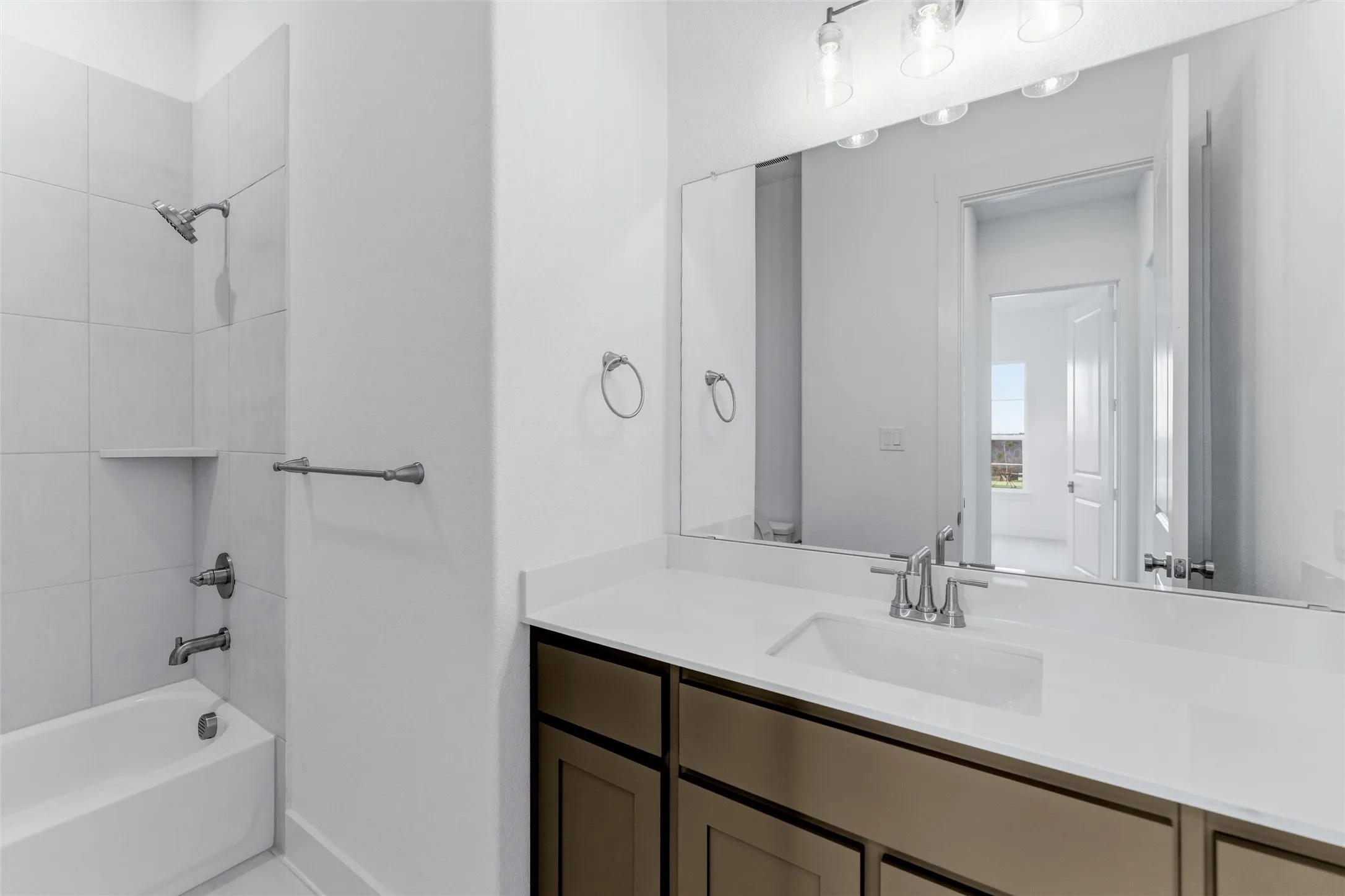 Bathroom with vanity and shower / bath combination