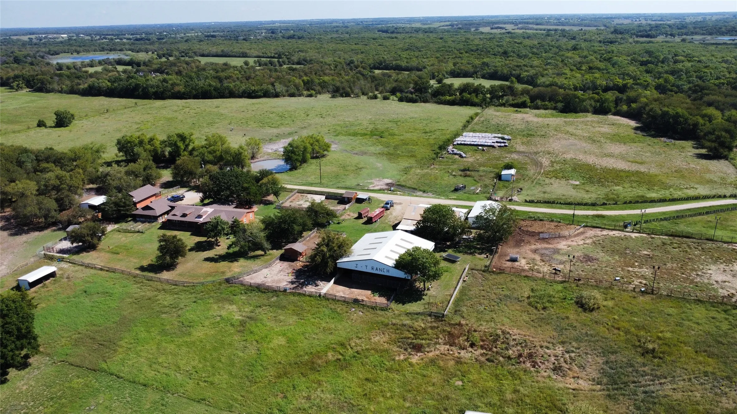 View of property location featuring rural landscape and a heavily wooded area