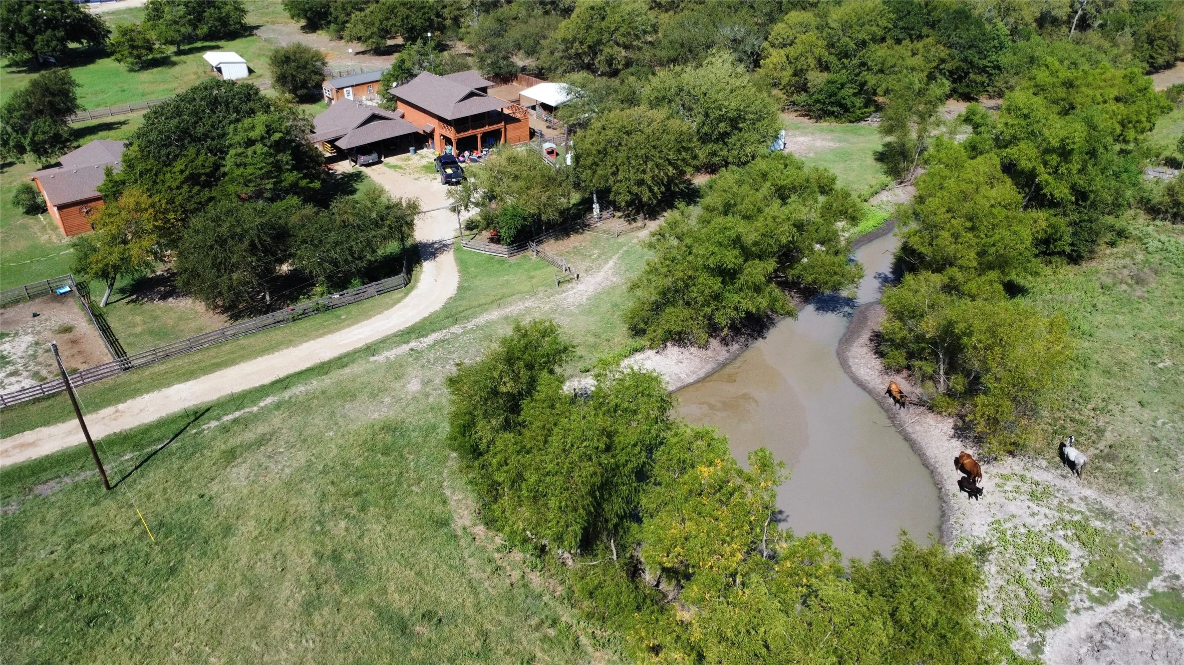 Aerial overview of property's location with a nearby body of water