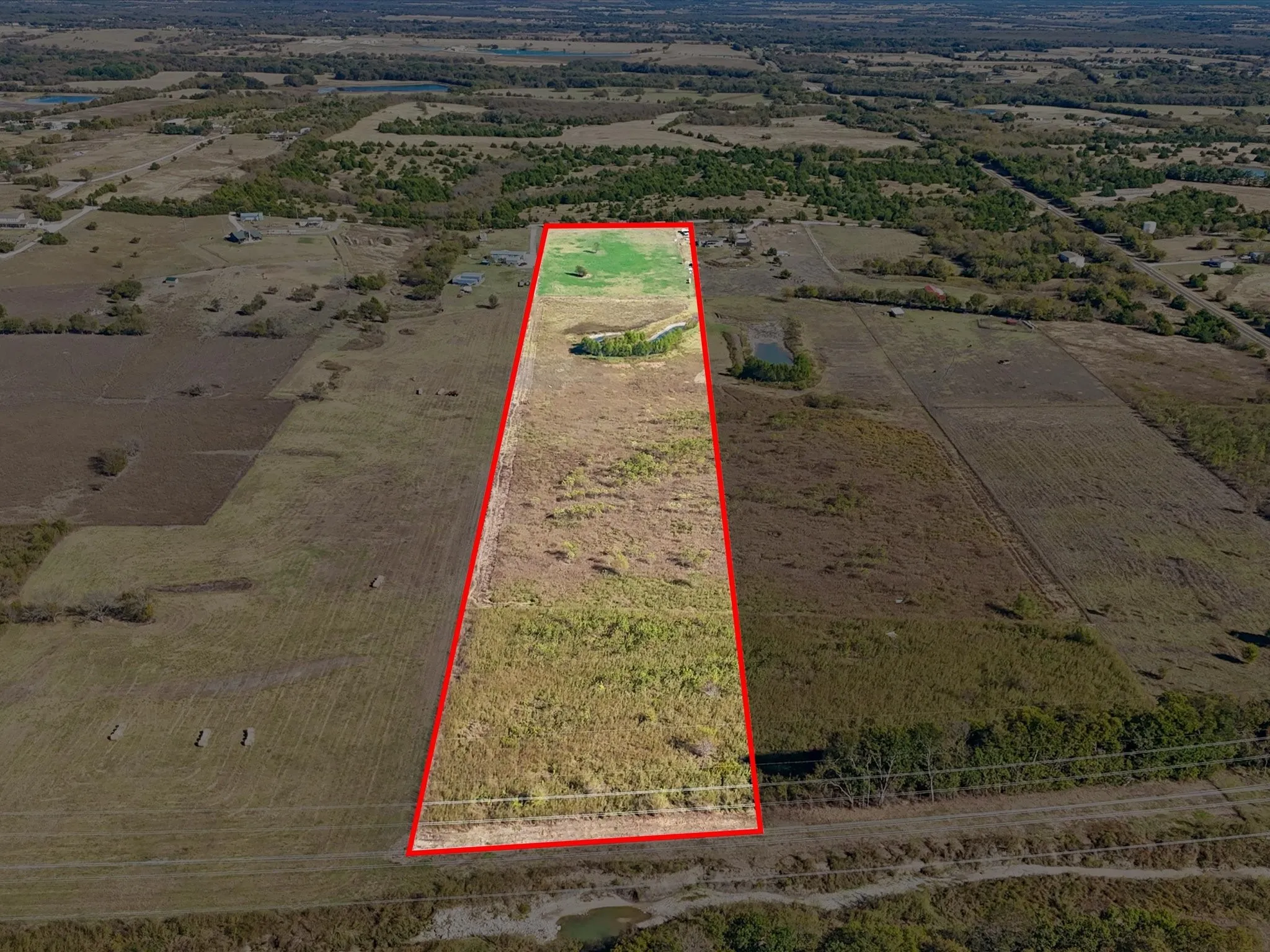 Overview of rural landscape with property parcel outlined