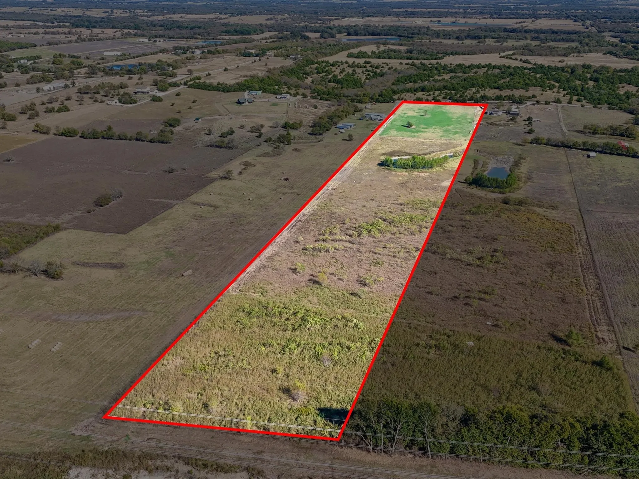 Overview of rural landscape featuring property boundaries highlighted
