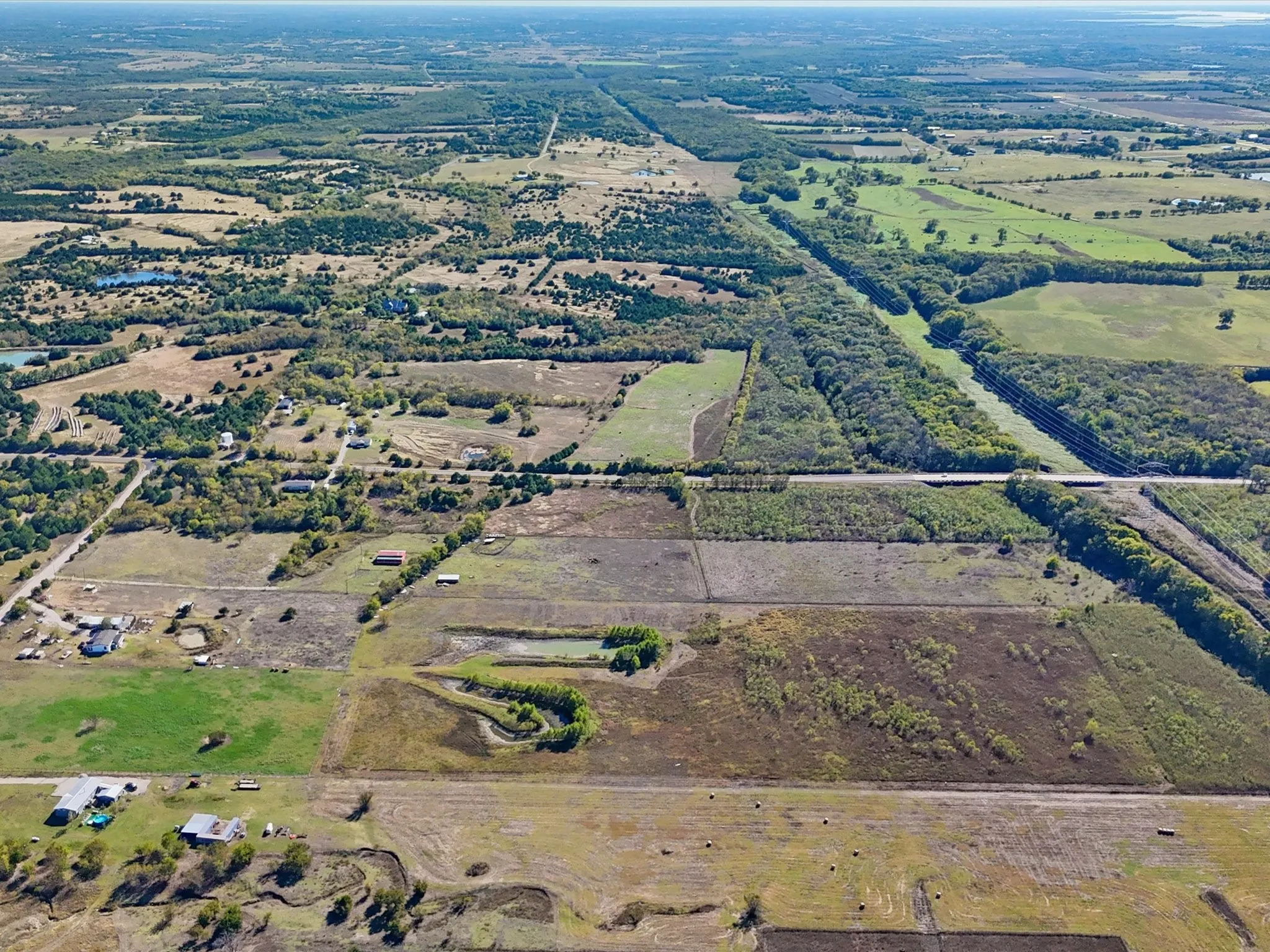 Aerial view of property's location featuring rural landscape