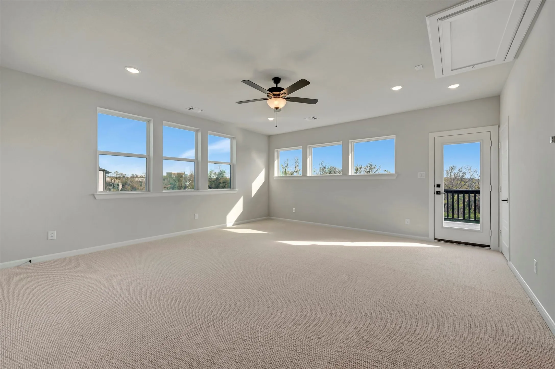 Unfurnished room with light carpet, recessed lighting, and a ceiling fan