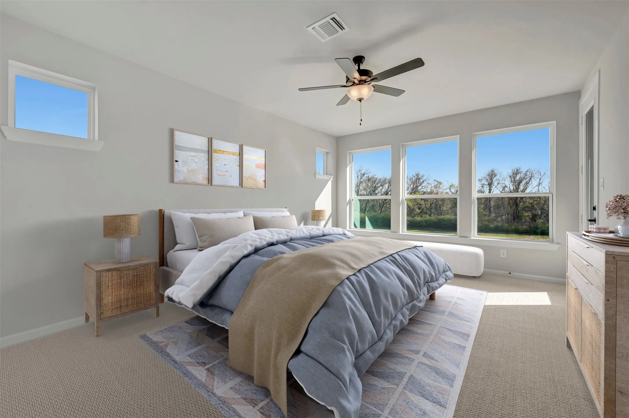 Bedroom with light colored carpet and a ceiling fan