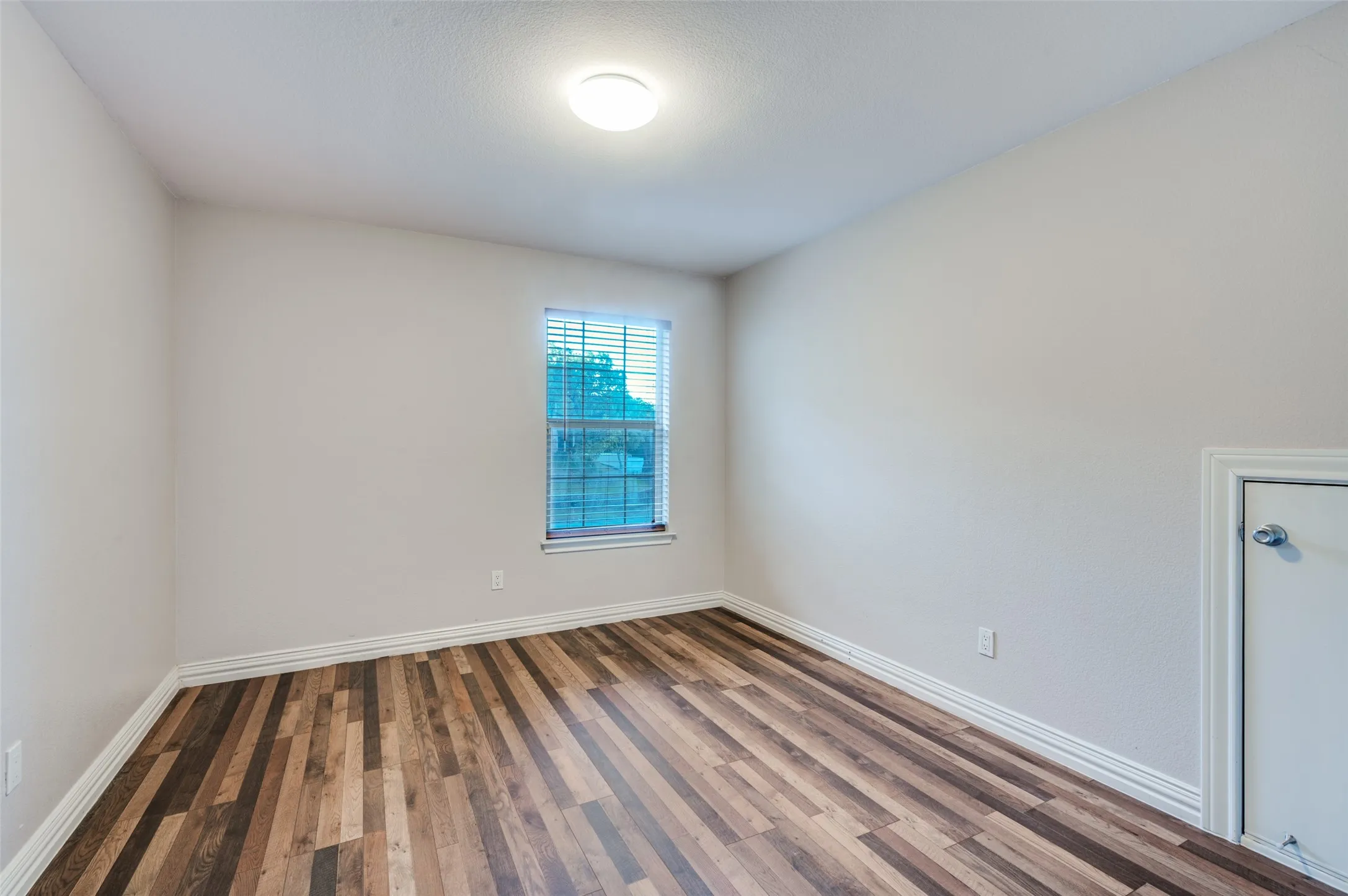 Very nice sized upstairs bedroom with beautiful flooring!