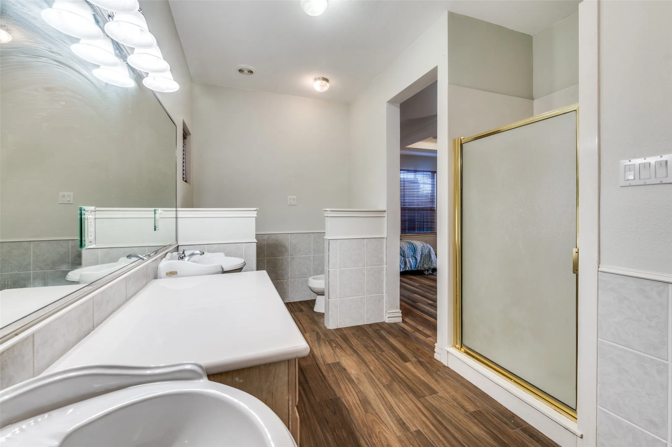 Primary bathroom with LONG vanity, separate sinks, bidet and toilet, separate shower and tub!