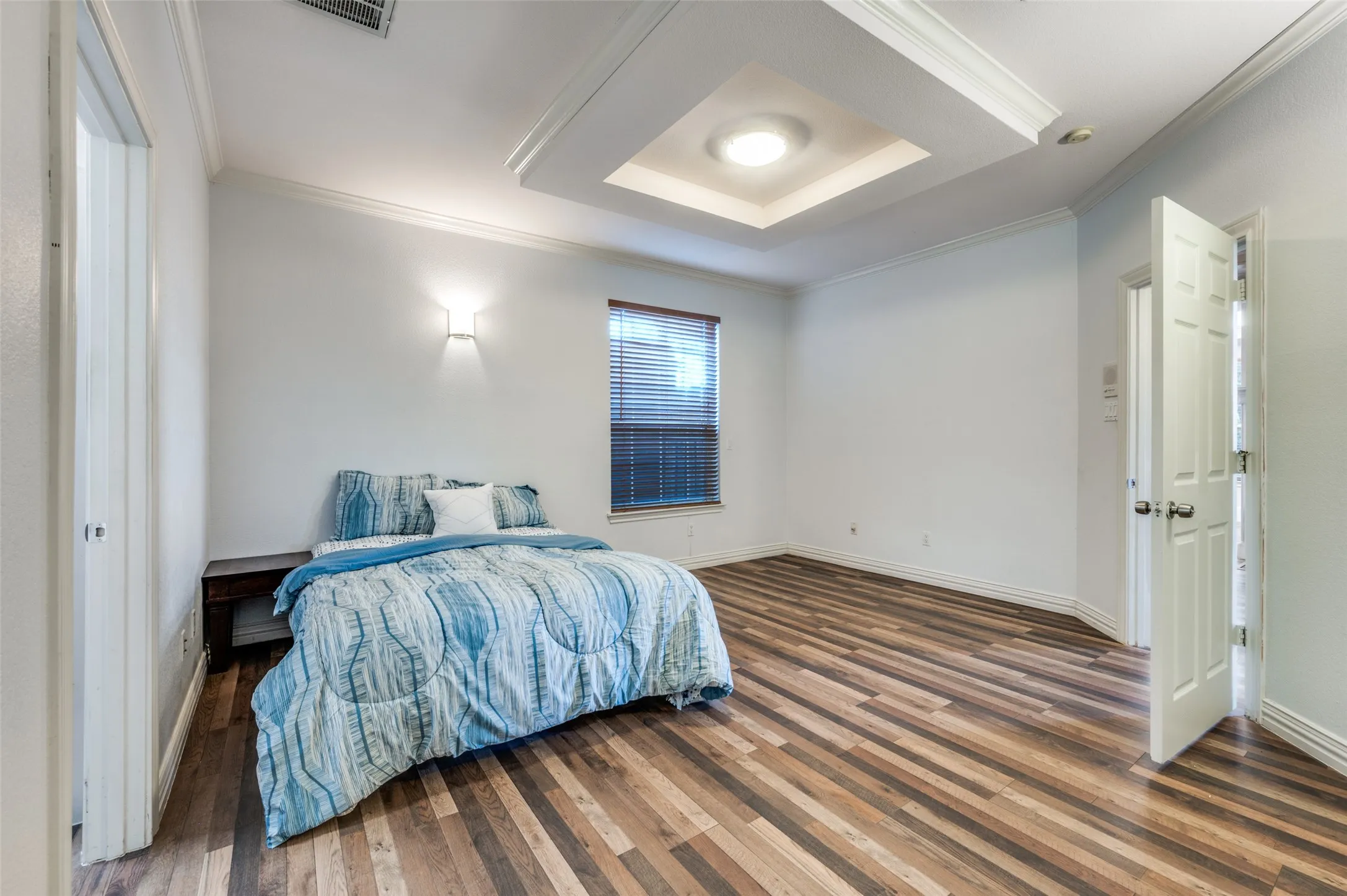 Oversized primary with gorgeous flooring AND a HUGE walk in closet, as well as an additional linen closet!