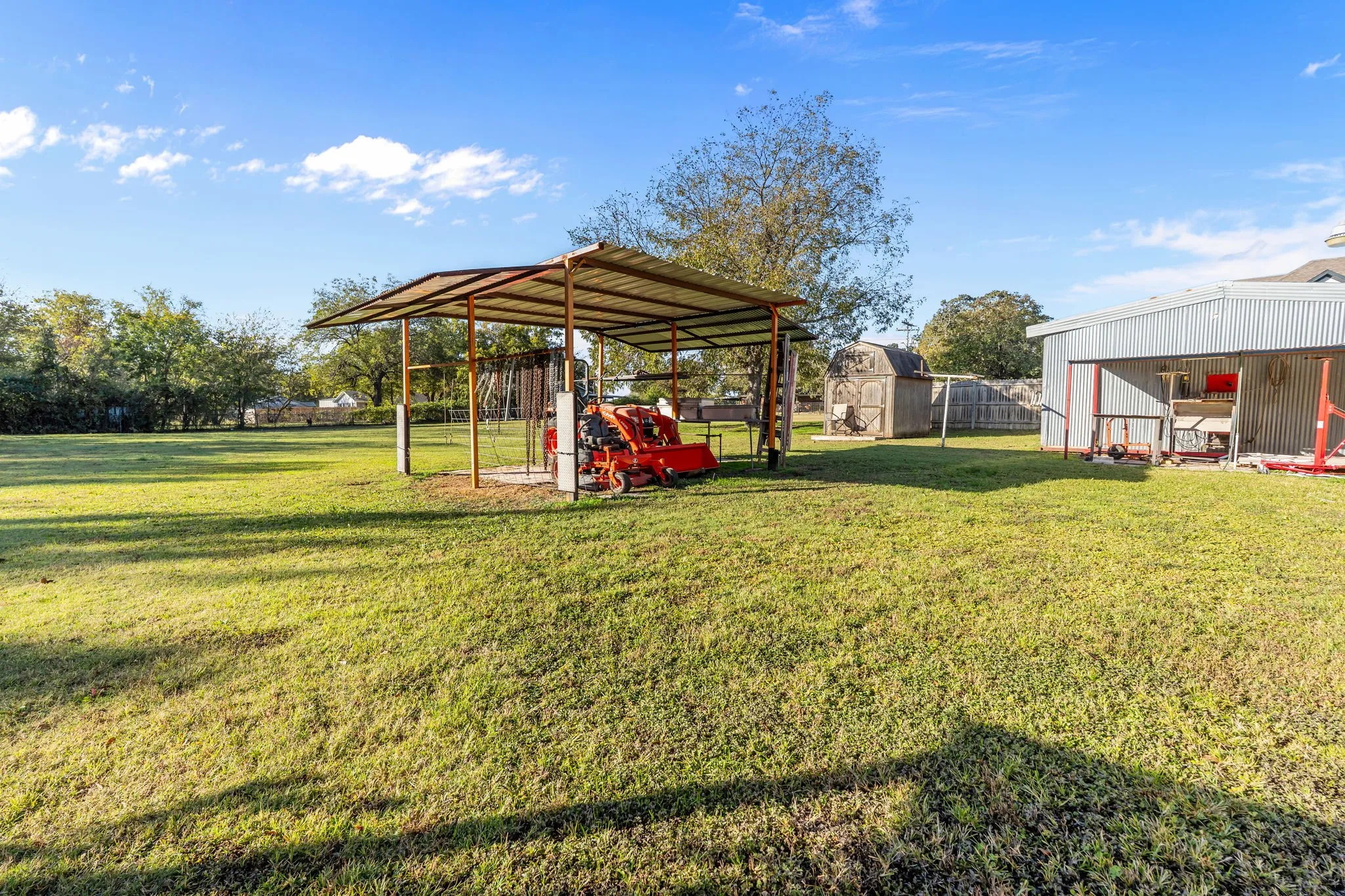 View of yard with an outbuilding and a patio