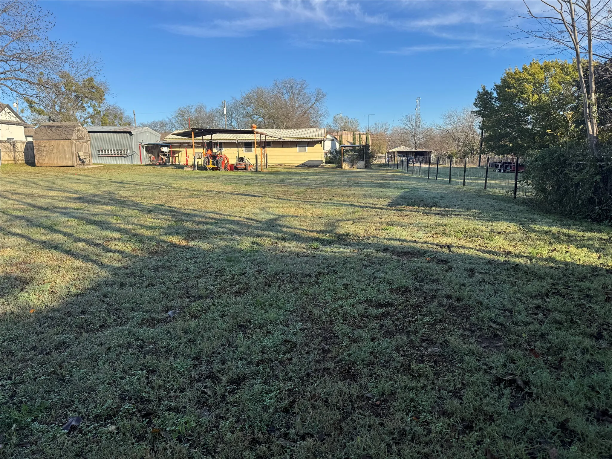 View of yard featuring a storage unit