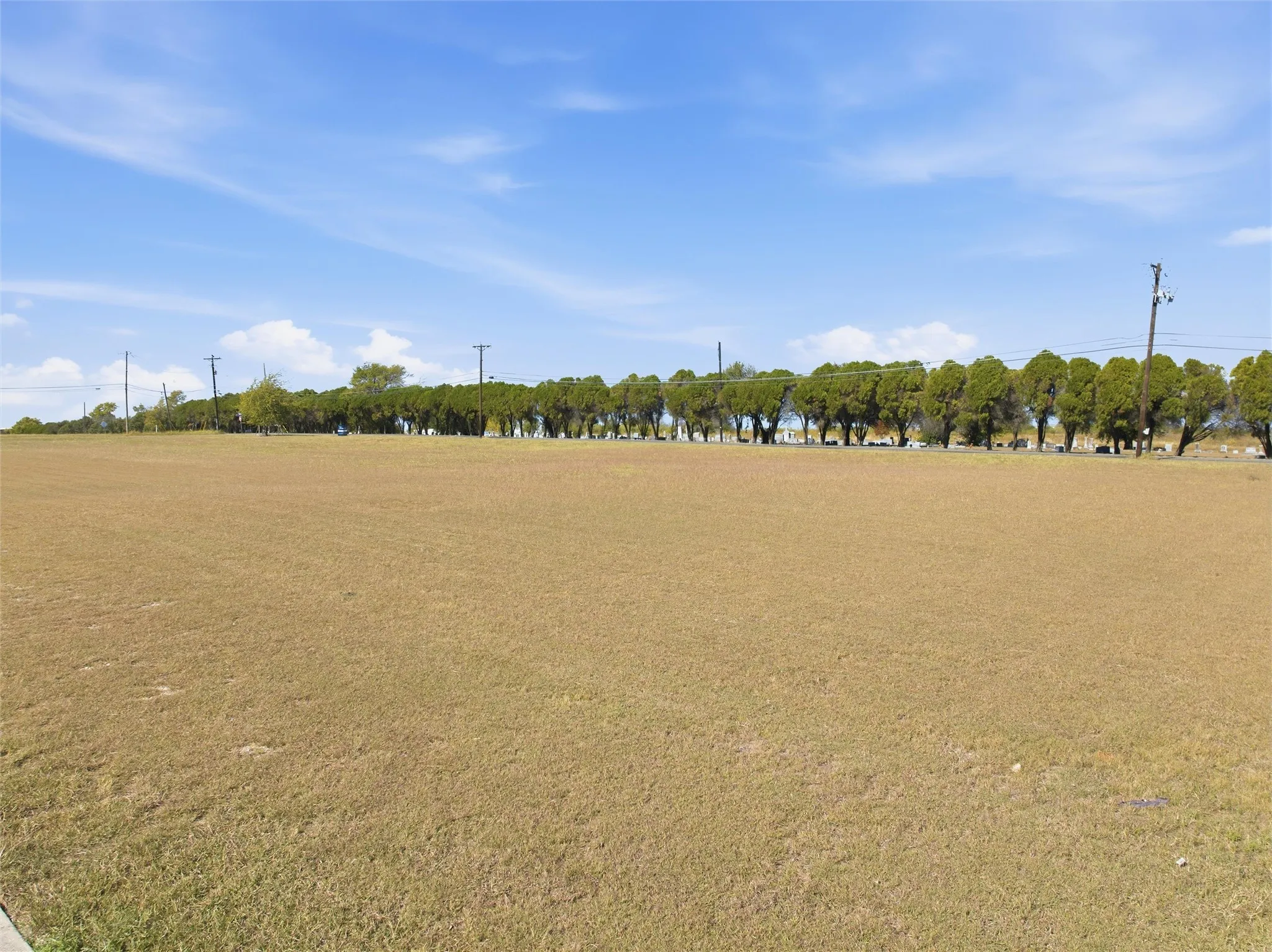 View of wooded area featuring a rural view