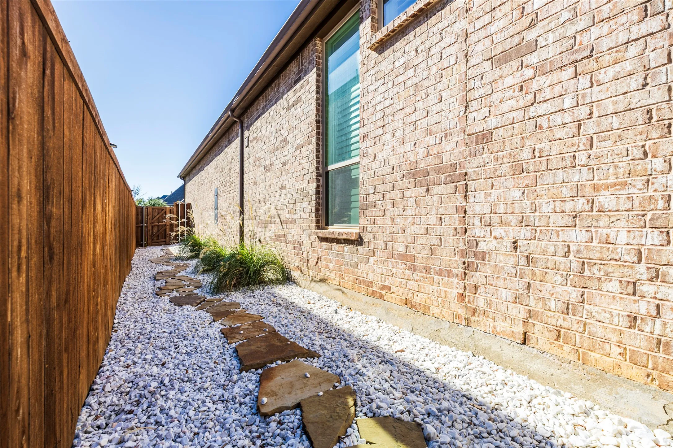 View of side of home with brick siding
