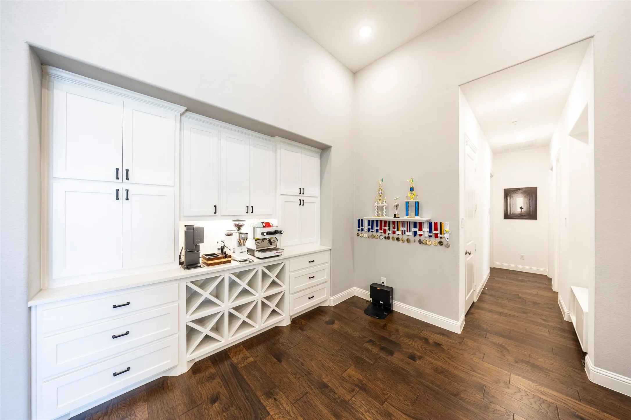 Bar featuring white cabinetry, dark wood-style floors, light countertops, and recessed lighting