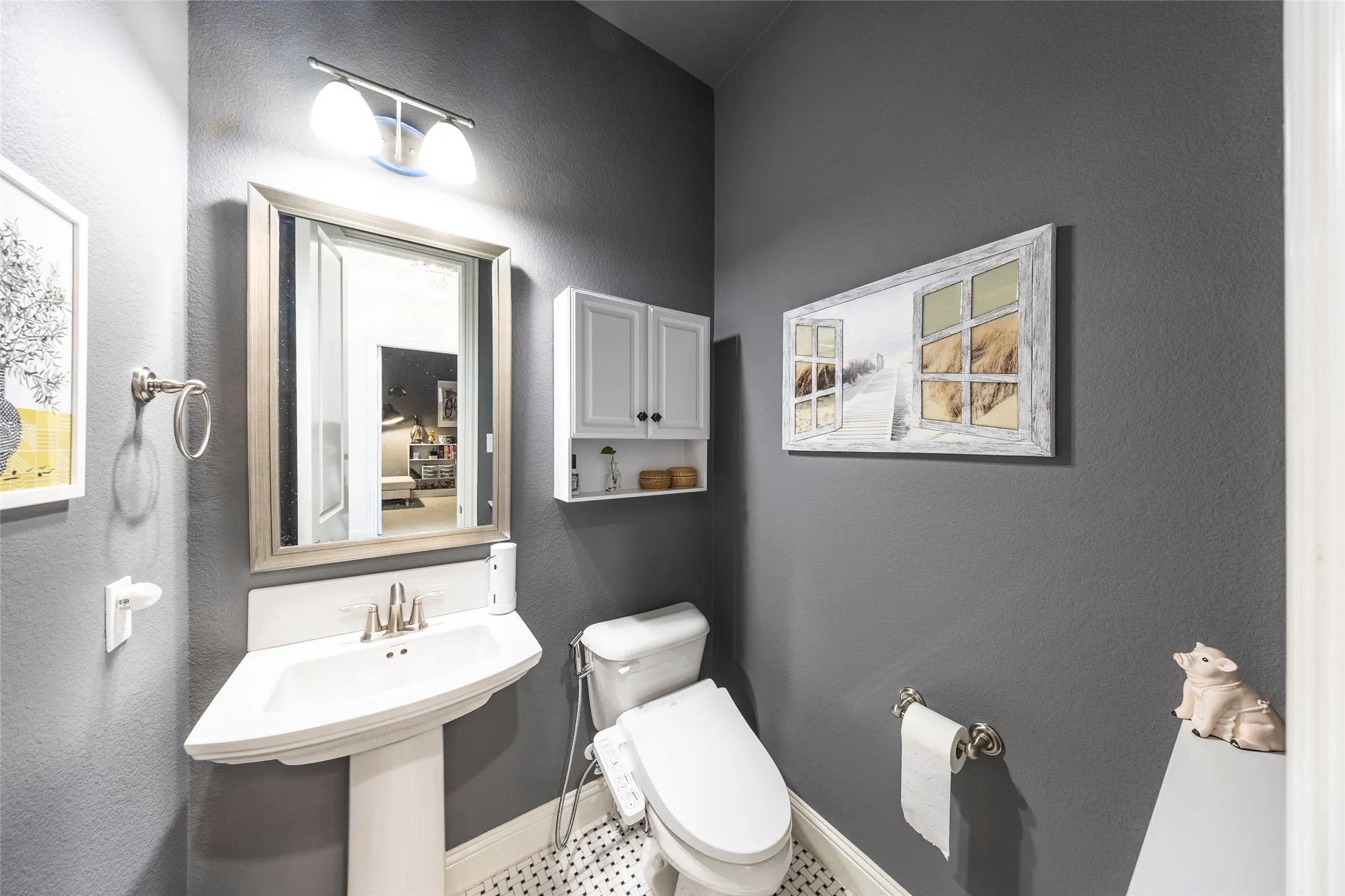 Bathroom featuring a textured wall and toilet