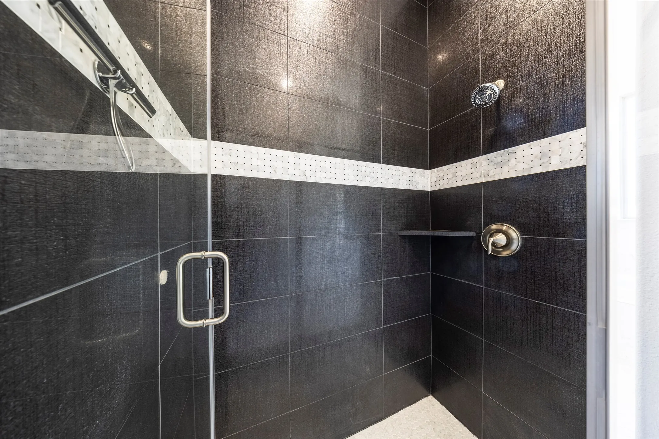 Full bathroom featuring a stall shower