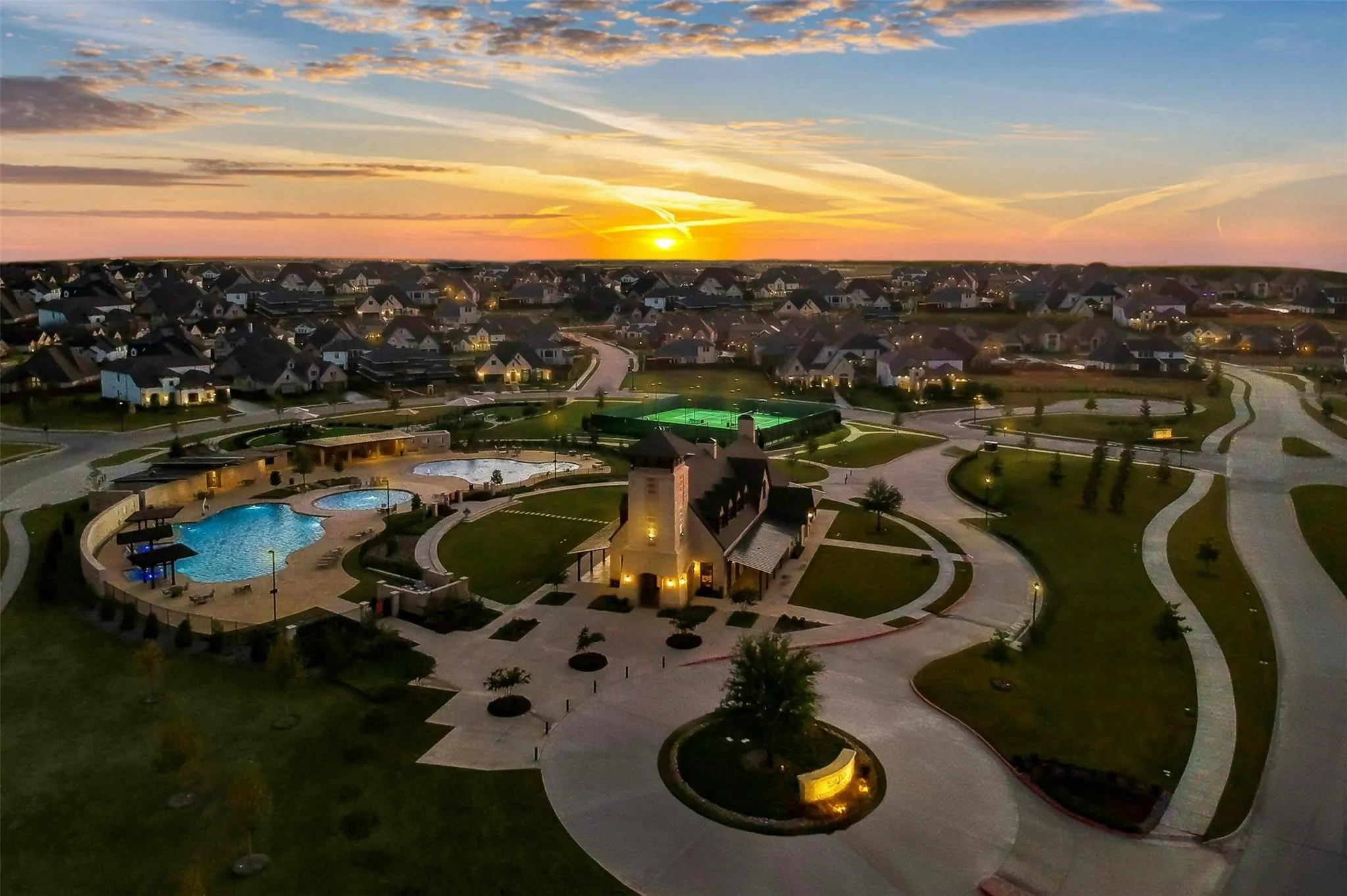 Aerial view of property's location featuring nearby suburban area and a pool