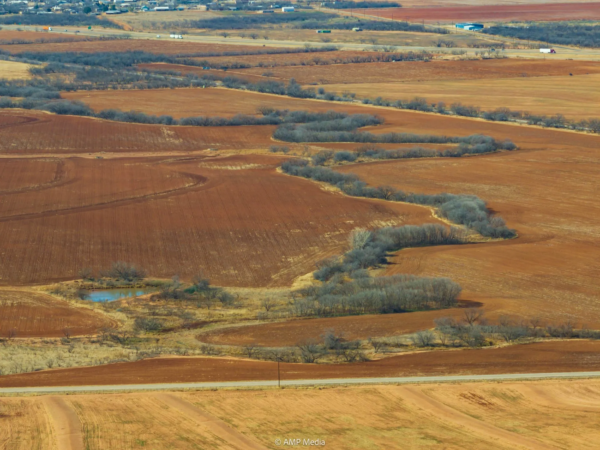 Overview of rural landscape featuring a large body of water