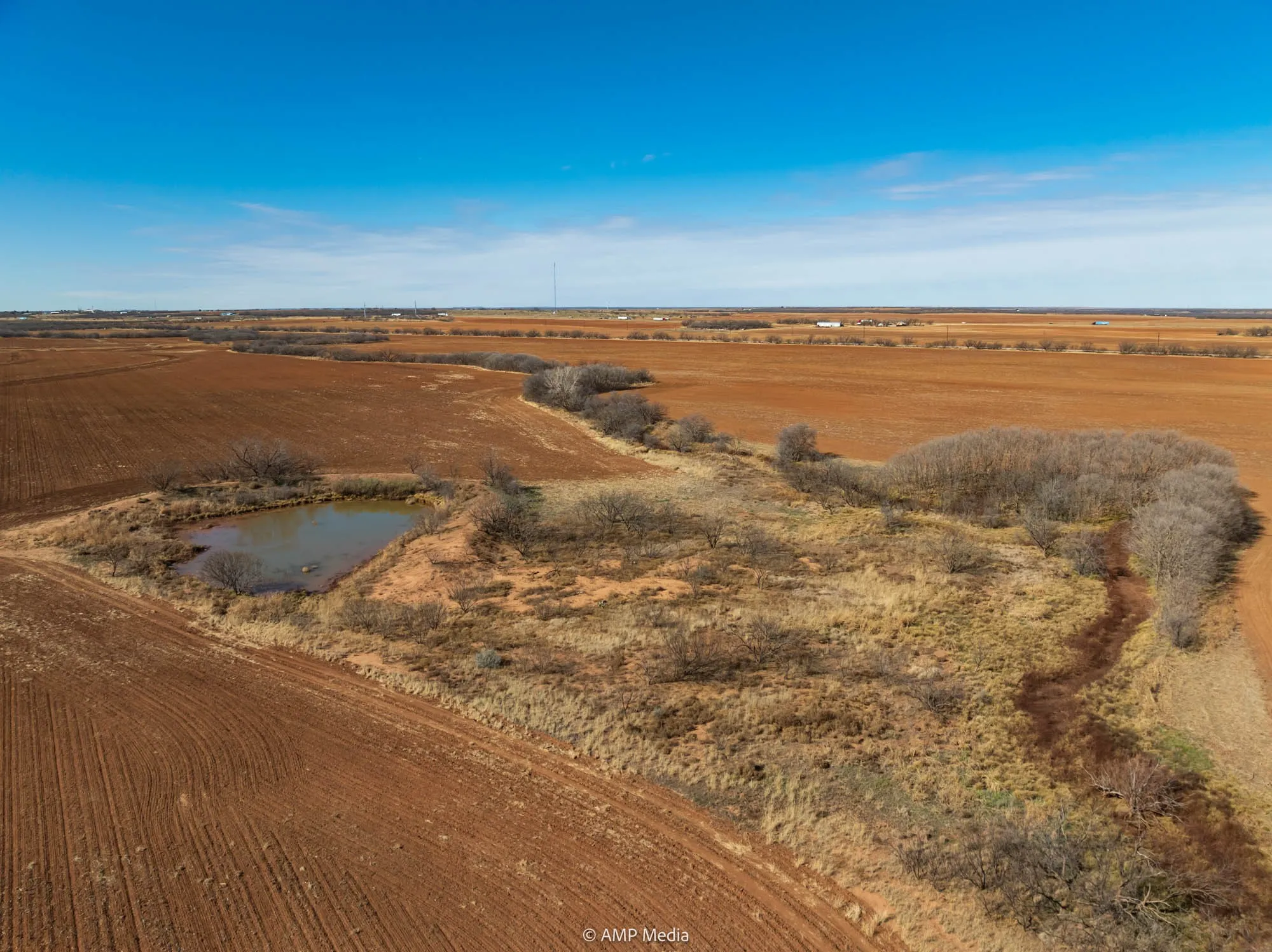 Aerial view of property's location with rural landscape and a nearby body of water