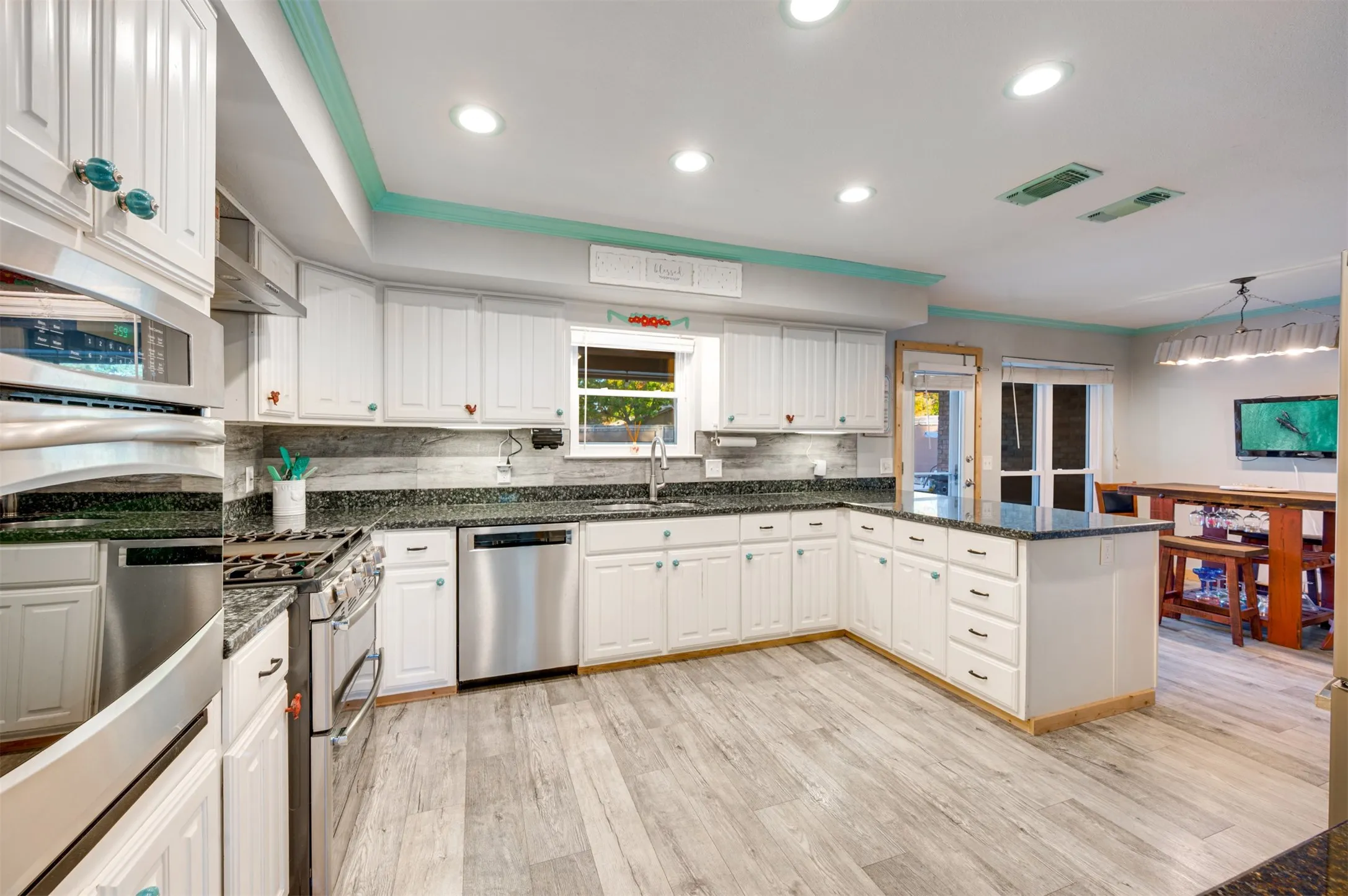 Large kitchen with SS appliances and breakfast bar