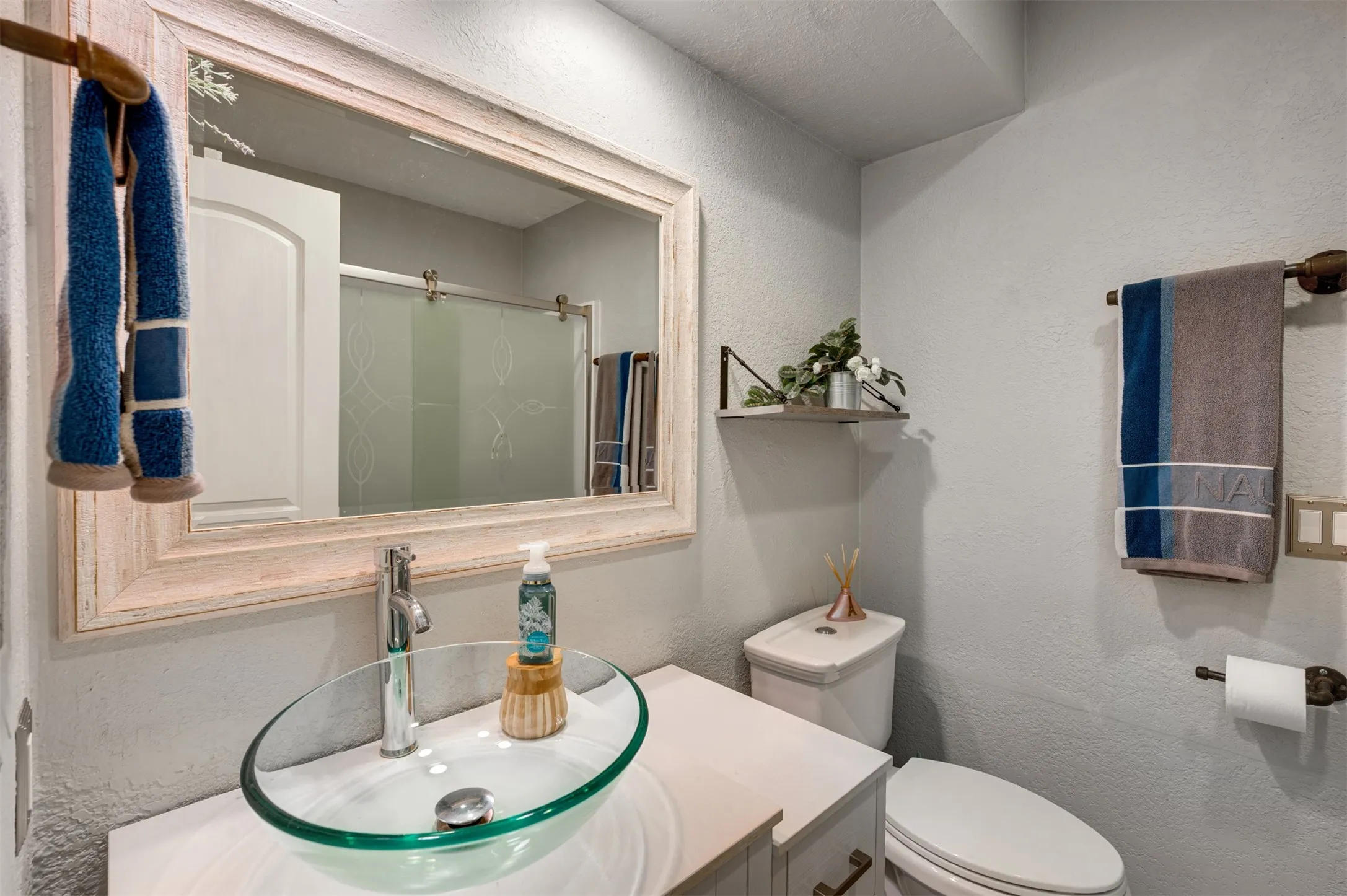 Hall bath has walk in shower