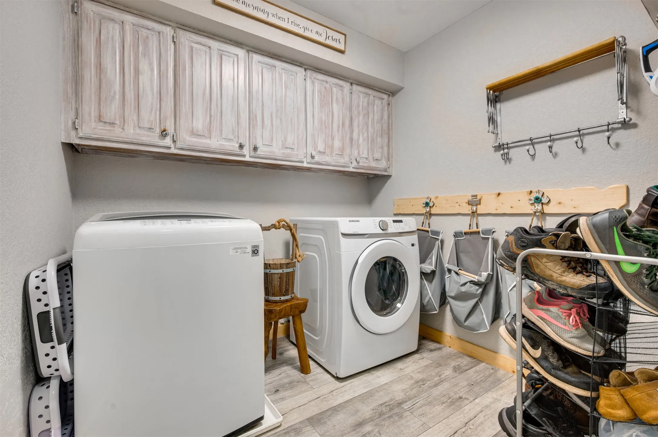 Laundry room near garage has space for folding table