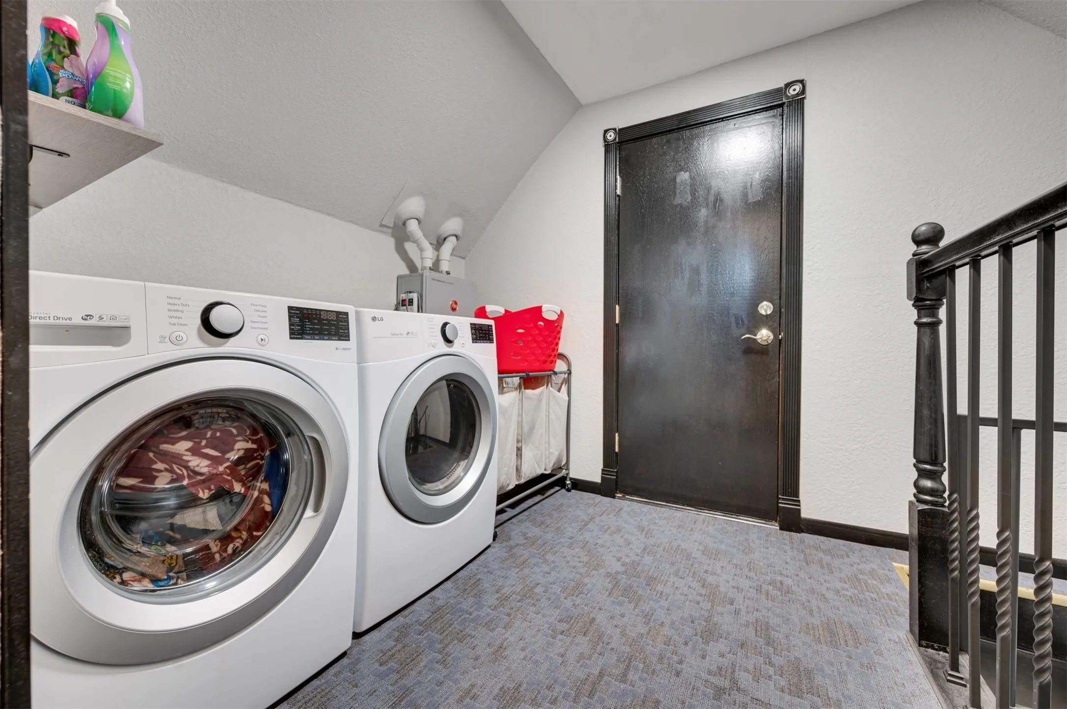 Second laundry room off bonus room and at top of spiral stairs to kitchen