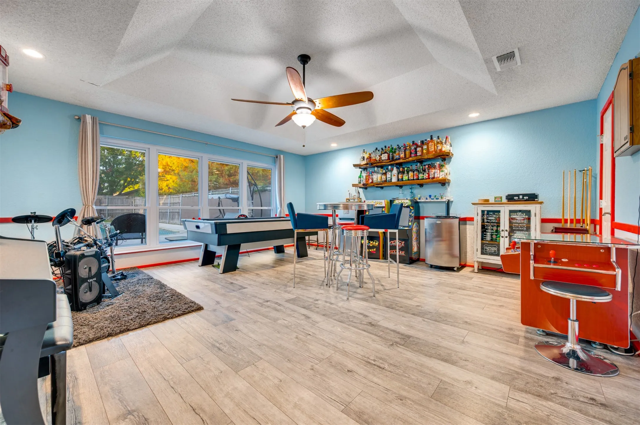 Game room or 5th bedroom with 1/2 bath located off kitchen and overlooking pool