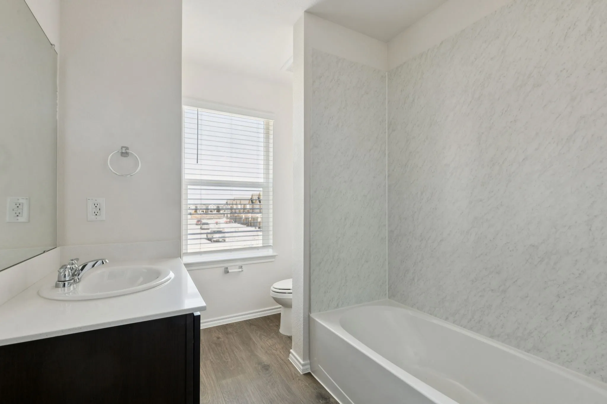 Bathroom with vanity and dark wood finished floors