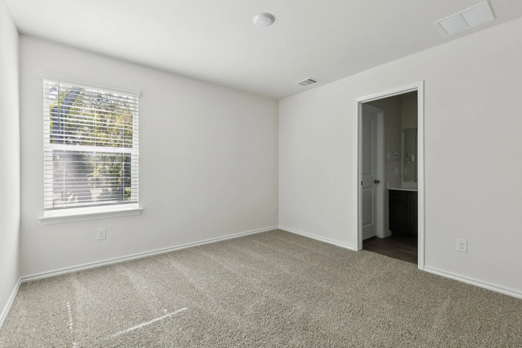 Spare room with carpet floors and baseboards