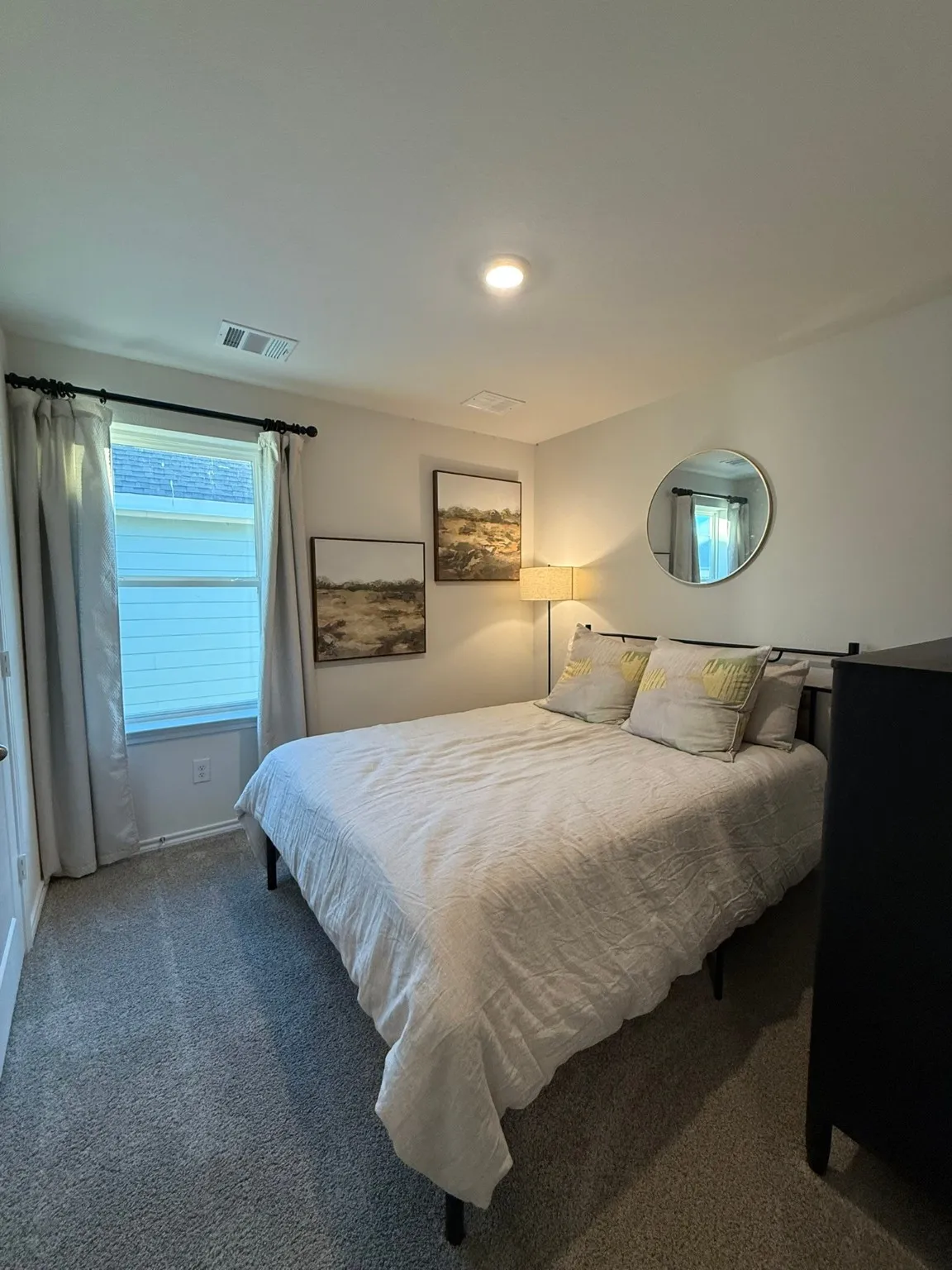 Bedroom with carpet floors and baseboards